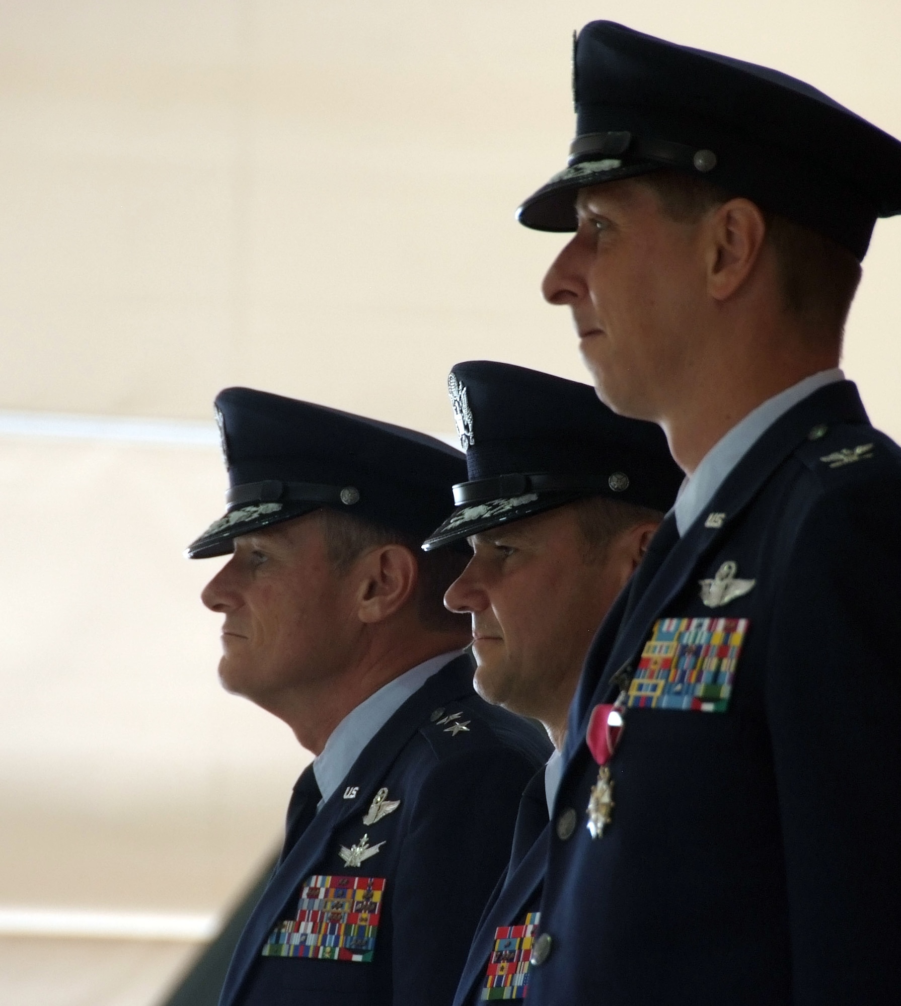Left to right are Maj. Gen. Irving L. Halter Jr., 19th Air Force commander; Col. Mark C. Nowland, incoming 71st Flying Training Wing commander; and Col. Richard A. Klumpp Jr., former 71st FTW commander. General Halter officiated the 71st FTW change of command July 11 at Vance AFB, Okla. (U.S. Air Force photo by Terry Wasson)