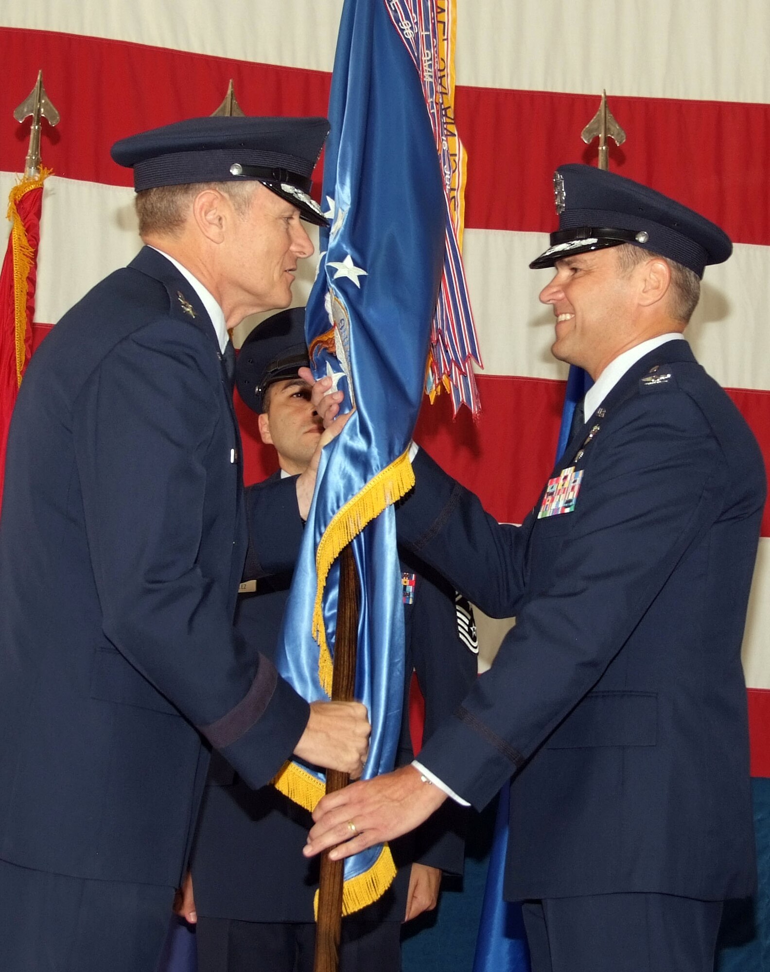 Col. Mark C. Nowland, right, accepts the guidon and command of the 71st Flying Training Wing from Maj. Gen. Irving L. Halter Jr., 19th Air Force commander, during a change of command ceremony July 11 at Vance AFB, Okla. Colonel Nowland comes to Vance from Royal Air Force Lakenheath, England, where he served as the vice commander of the 48th Fighter Wing. (U.S. Air Force photo by Terry Wasson)