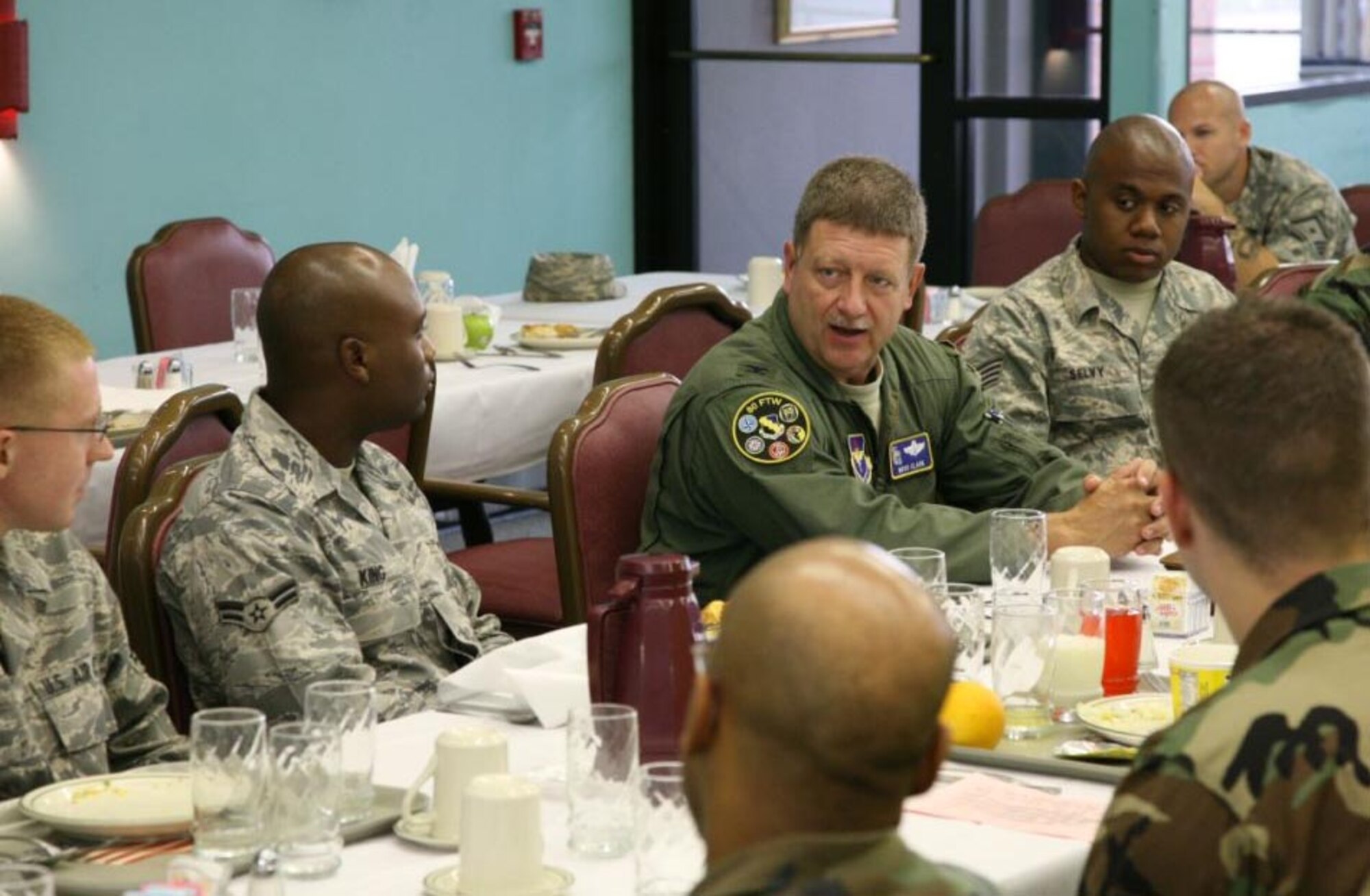 Col. Dan Clark, 19th Air Force vice commander, visits with enlisted members of the 80th Flying Training Wing July 15 at a breakfast hosted by wing Superintendent Chief Master Sgt. Norman Thierolf and Master Sgt. Keith Fitzpatrick, first sergeant for the wing. Although this was the colonel's initial visit in his new capacity, he began his Air Force career as a student pilot at the Euro-NATO Joint Jet Pilot Training Program in 1985. (U.S. Air Force photo/Lt. Col. Ternell Washington)
