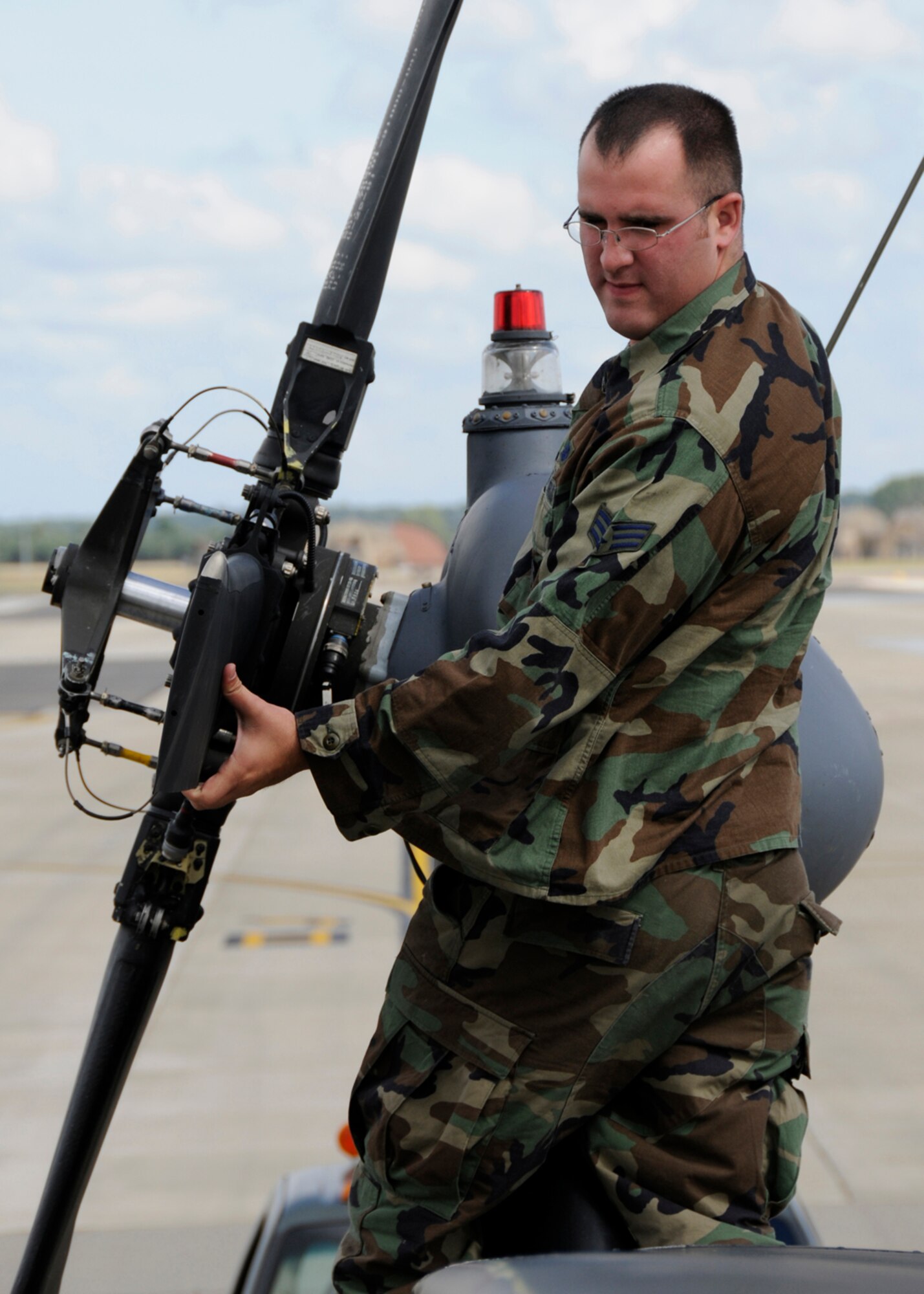 Senior Airman Michael Barber, 48th Aircraft Maintenance Squadron HH-60G helicopter crew chief inspects the tail rotor blades for cracks and abrasions, July 10 at RAF Lakenheath, England. This is one of the many critical checks the crew chiefs must do after every flight. (U.S. Air Force photo by Airman Perry Aston) 