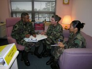 SEYMOUR JOHNSON AIR FORCE BASE, N.C. -- Inspections for the 916th Air Refueling Wing ended on Wednesday as the medical and flying inspections came to a close. One area inspected in the 916th Medical Flight was dental. Pictured here Lt. Col. Frances McClure (middle), head of the dental clinic and Staff Sgt. Cythina Zamara (right) talk to their inspector. Inspectors conducted outbriefs from Sunday to Wednesday across all areas including commander's programs, maintenance, flying and medical. U.S. Air Force photo/Ms. Donna Lea