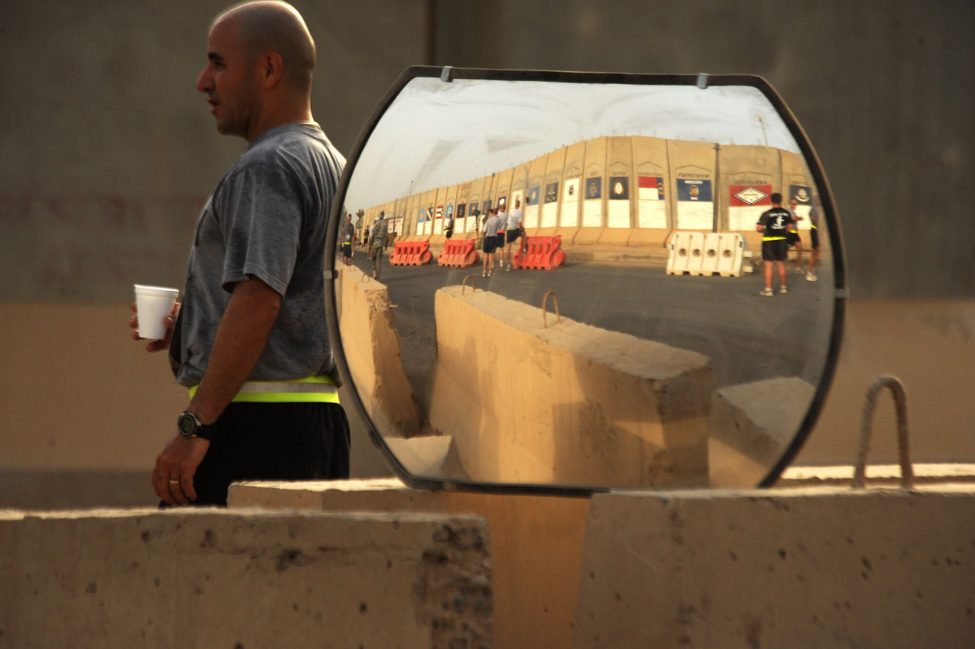 One of the more than 240 deployed servicemembers who participated in the first Baghdad Boilermaker 15-kilometer race June 13 at Sather Air Base, Iraq, cools down following the race. The race was organized by Master Sgts. James Carrabba and Jeffrey Conant who have both participated in the Utica, N.Y., Boilermaker for years. (U.S. Air Force photo/Tech. Sgt. Jeffrey Allen) 