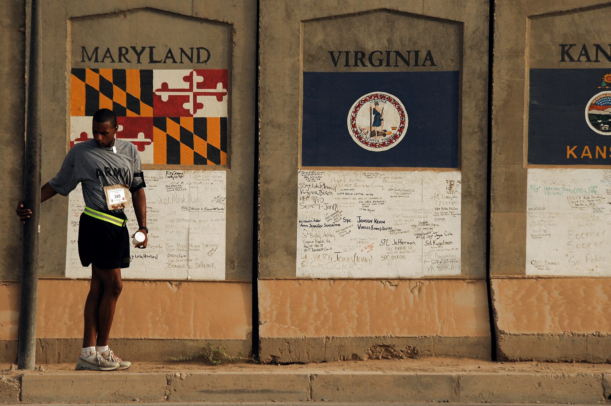 A participant stretches in preparation for the first Baghdad Boilermaker 15-kilometer race June 13 at Sather Air Base, Iraq. The race was organized by Master Sgts. James Carrabba and Jeffrey Conant who have both participated in the Utica, N.Y., Boilermaker for years. (U.S. Air Force photo/Tech. Sgt. Jeffrey Allen) 
