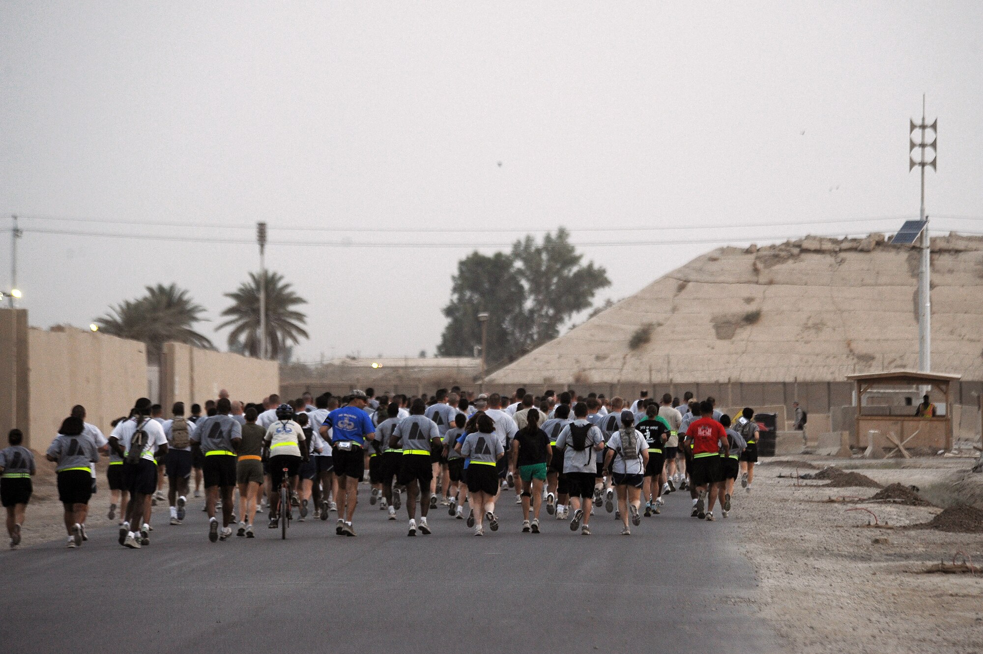 More than 240 deployed servicemembers from around the Victory Base complex participate in the Baghdad Boilermaker 15-kilometer race June 13 at Sather Air Base, Iraq. The race was organized by Master Sgts. James Carrabba and Jeffrey Conant who have both participated in the Utica, N.Y., Boilermaker for years. (U.S. Air Force photo/Tech. Sgt. Jeffrey Allen) 