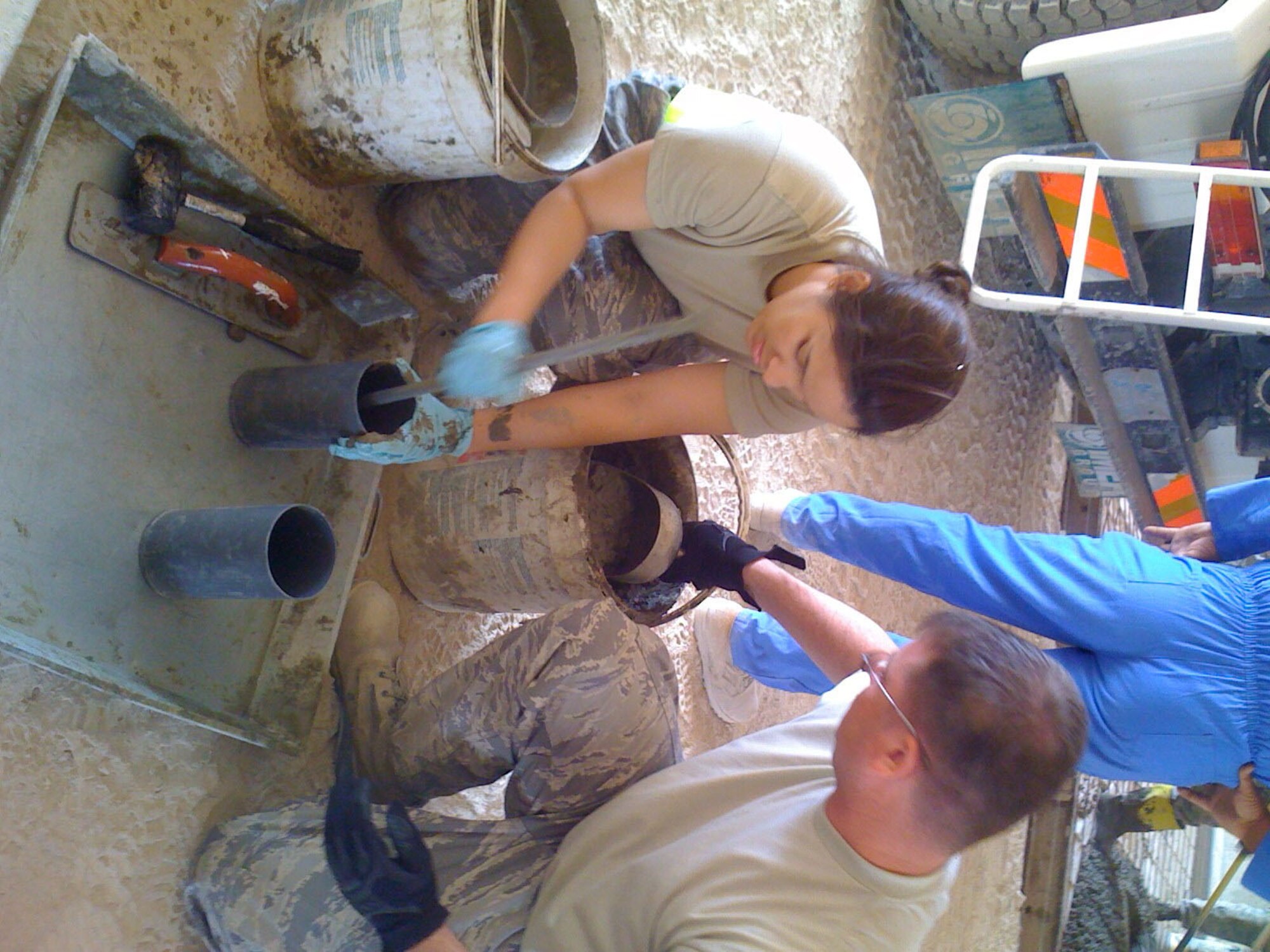 SEYMOUR JOHNSON AIR FORCE BASE, N.C. -- Tech. Sgt. Sol Rios-Montalvo (left), a Reservist with the 916th Civil Engineer Squadron, prepares a concrete sample for testing. She is currently assigned to the 557th RedHorse Squadron at Bagdhad International Airport, Iraq. She was recently awarded noncommissioned officer of the month with her deployed squadron.
