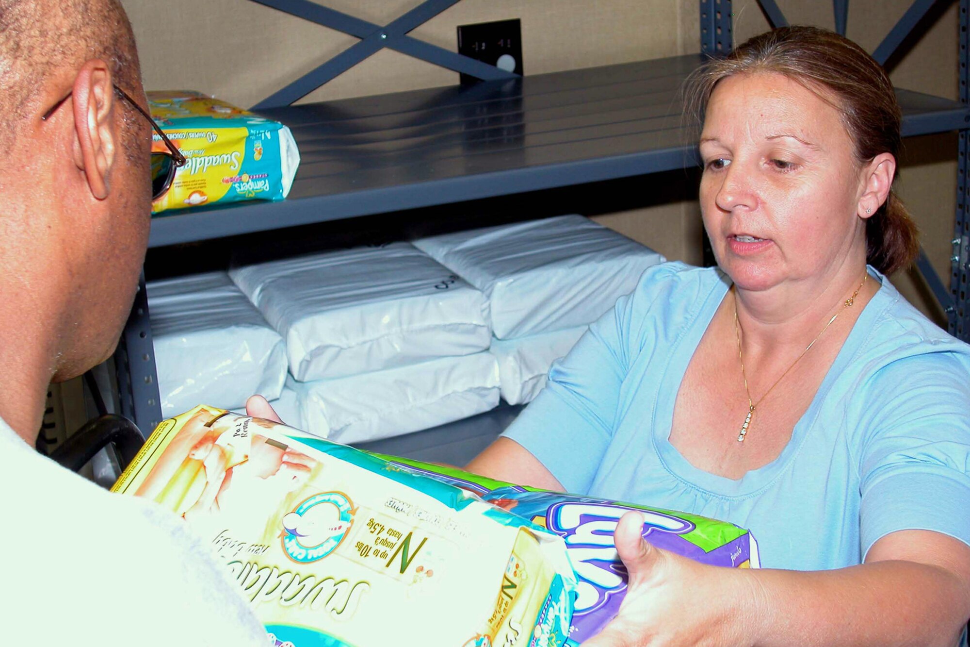 GRISSOM AIR RESERVE BASE, Ind., -- Victoria Petrowski, a student hire with the Airman and Family Readiness Center, loads items for the center's Bundles for Babies program. The program is spearheaded by the center's Master Sgt. Sherry Burks, and helps new or soon to be parents adjust to their new or impending family member. (U.S. Air Force photo/Staff Sgt. Chris Bolen)