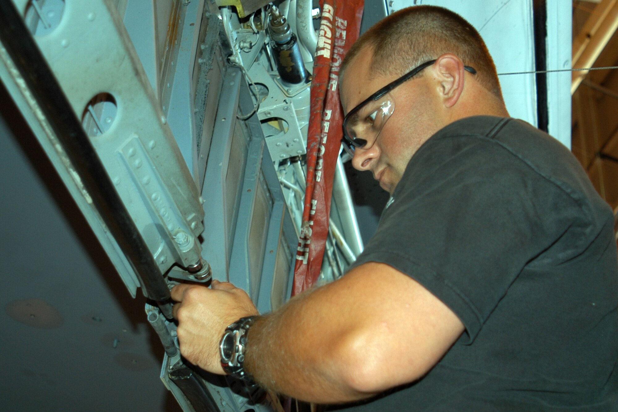 GRISSOM AIR RESERVE BASE, Ind., -- Staff Sgt. Daniel Helms, a crew chief with the 434th Aircraft Maintenance Squadron, lubricates the rollers and flap tracks on a KC-135R Stratotanker. After aircraft are washed it is policy that they are lubricated to prevent corrosion. (U.S. Air Force photo/Senior Airman Carl Berry)                             