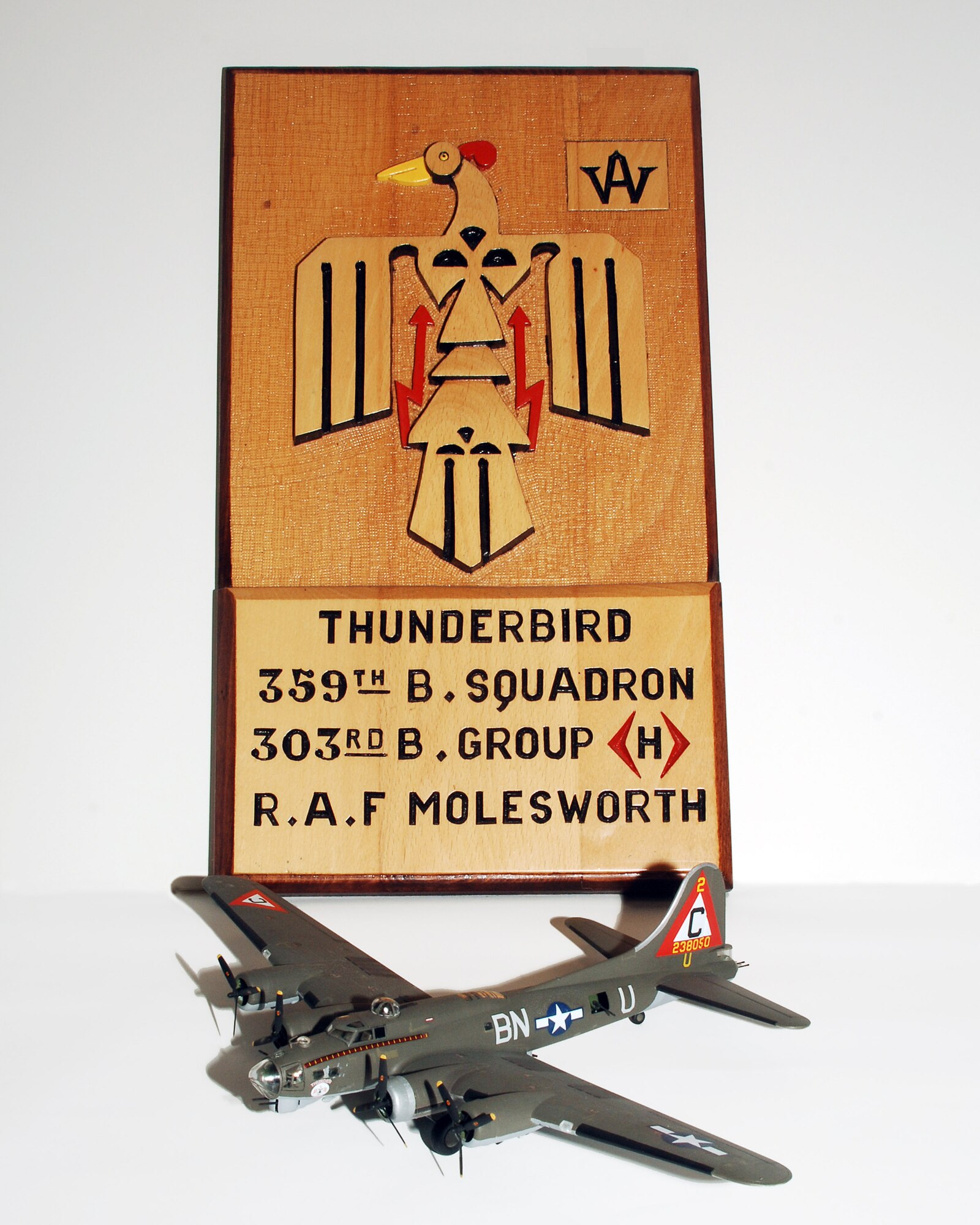 A model of the famed B-17G Flying Fortress “Thunderbird’ which flew 29 combat missions between December, 1943 and April 1944 together with a  woodcarving of the nose art from the aircraft by British woodcarver Bill Adams.   “Thunderbird” was shot up many times during raids over Nazi occupied Europe – and even had a wing replaced – but no crew members suffered as much as a scratch during that time.  The plane is memorialized in a mural at the National Air and Space Museum in Washington, DC.  The model built by JAC Division Chief Army Major Bret C. Kinman has been donated to the JAC by Maj. Kinman in appreciation of the sacrifice of the 7,336 men who served at Molesworth during WWII.  (U.S. Air Force photo by Staff Sgt. Chad E. Chisholm)