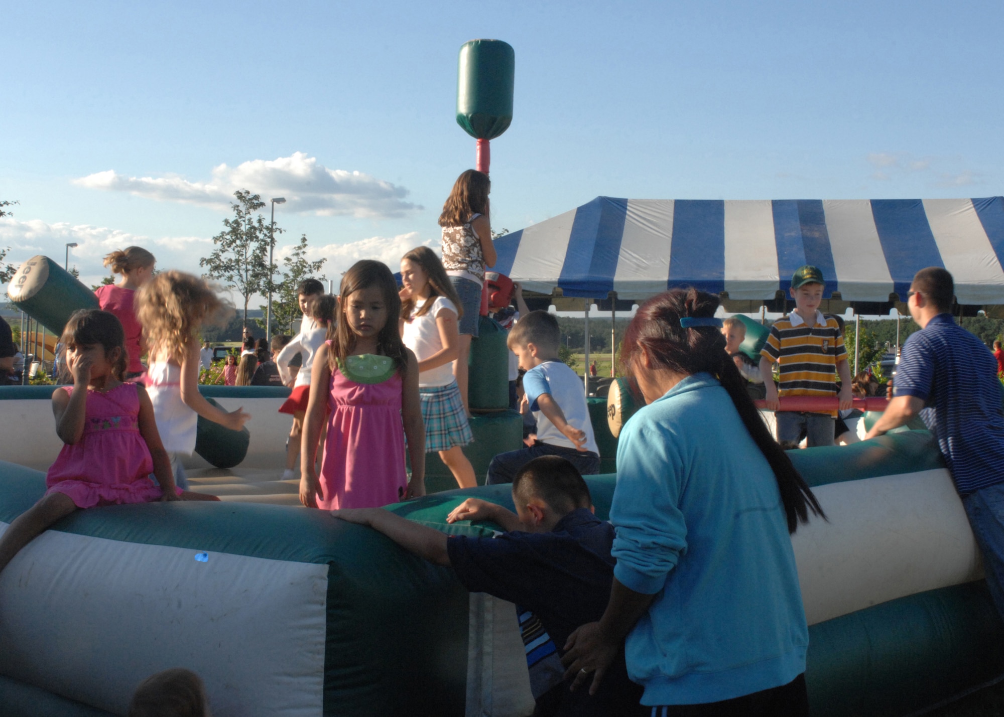 SPANGDAHLEM AIR BASE, Germany-- Children play on the Jeep Jouster at the Independence Day Extravaganza July 4, 2008. The Jeep Jouster, as well as the Castle Bounce, provided entertainment for the children.  U.S. Air Force Photo by Airman 1st Class Jenifer Calhoun