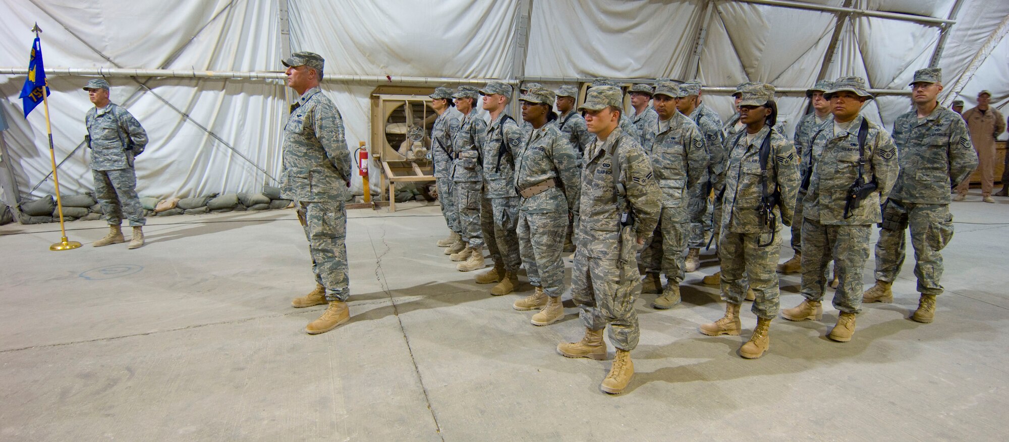 BAGRAM AIR FIELD, Afghanistan -- A formation representing the 755th Air Expeditionary Group stands ready, here, on July 11, 2008. The formation, commanded by Lt. Col. Shaun Copelin, assembled for the 755th AEG's change of command ceremony.(U.S. Air Force photo by Staff Sgt. Samuel Morse)