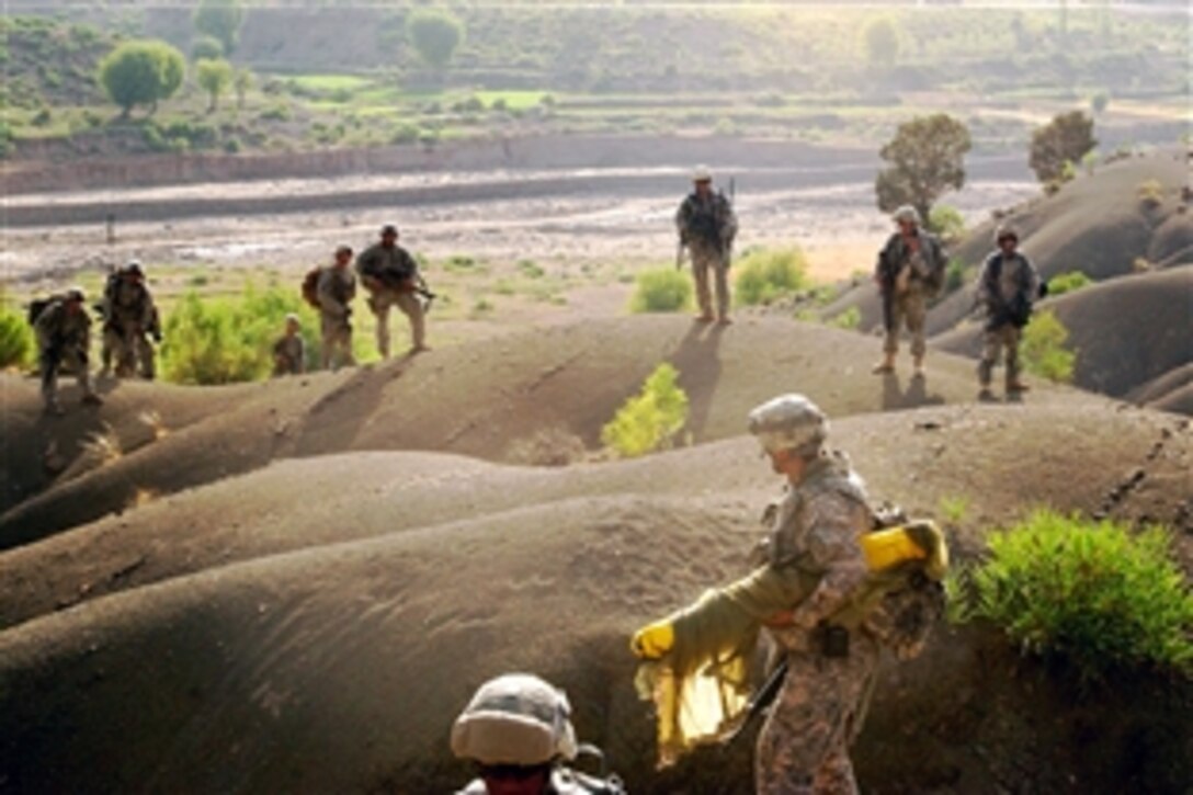 U.S Army soldiers survey a proposed site for a new observation post, Combat Outpost Zerok, in Afghanistan, July 11, 2008. The soldiers are assigned to Task Force Castle’s 420th Engineer Brigade.