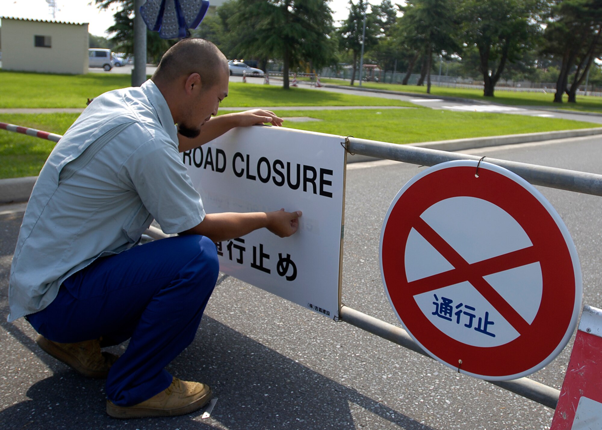 MISAWA AIR BASE, Japan -- A Japanese construction worker updates road closure information July 17, 2008.  Base residents should be prepared to use alternative routes during base road construction.  (U.S. Air Force photo by Senior Airman Chad Strohmeyer)