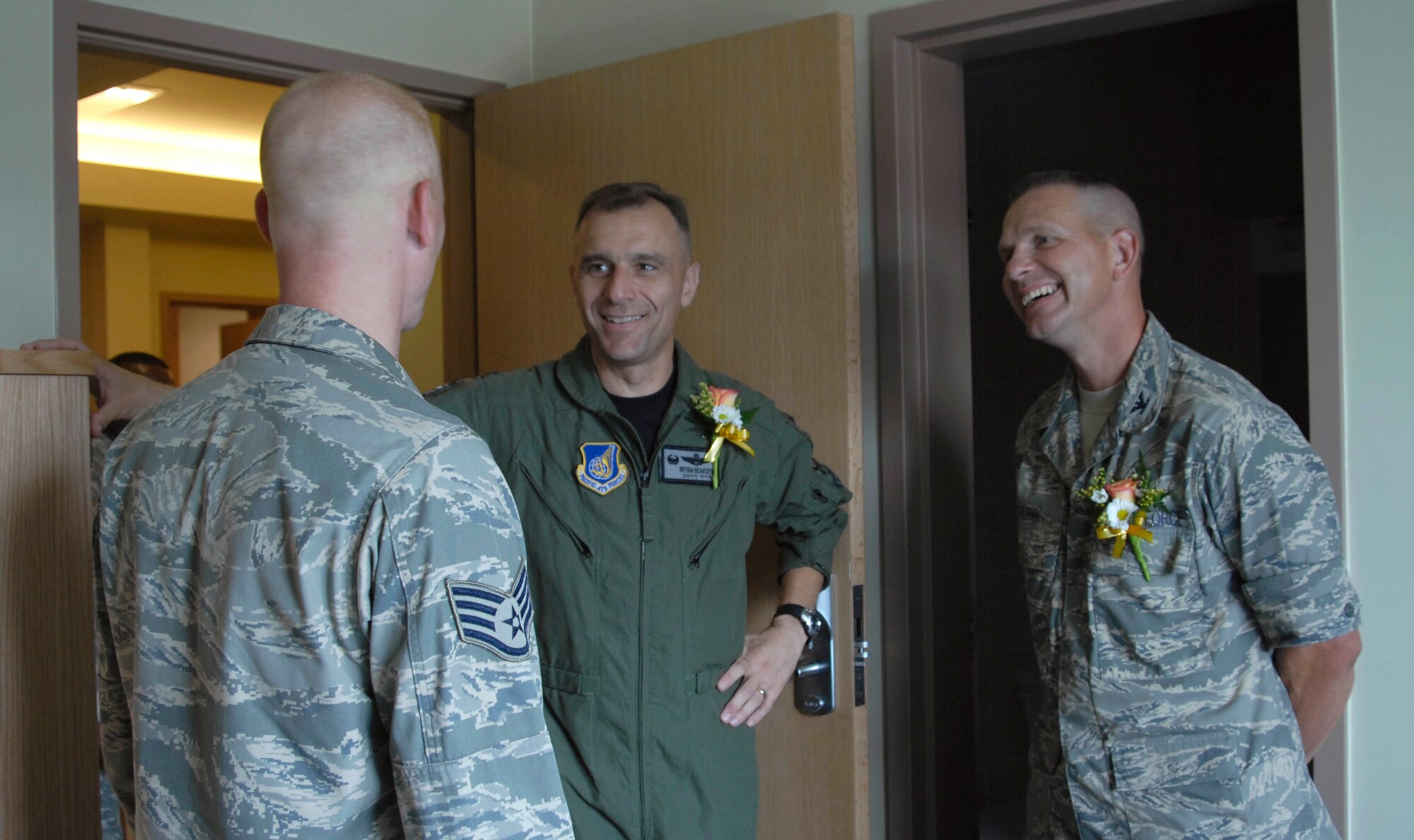 KUNSAN AIR BASE, Republic of Korea--Colonel Bryan "Wolf" Bearden, 8th Fighter Wing commander, Col. Harry "Phoenix" Truhn, 8th Maintenance Group commander and Staff Sgt. Michael Howe, 8th Civil Engineer Squadron, take a tour of the new dormitory rooms following the ribbon cutting ceremony here July 16. The ceremony dedicates the completion of the Wolf Pack's new FY06 tower dormitory. The project is part of the Air Force's initiative to improve the quality of life for Airmen. (U.S. Air Force photo by Senior Airman Dana Hill)