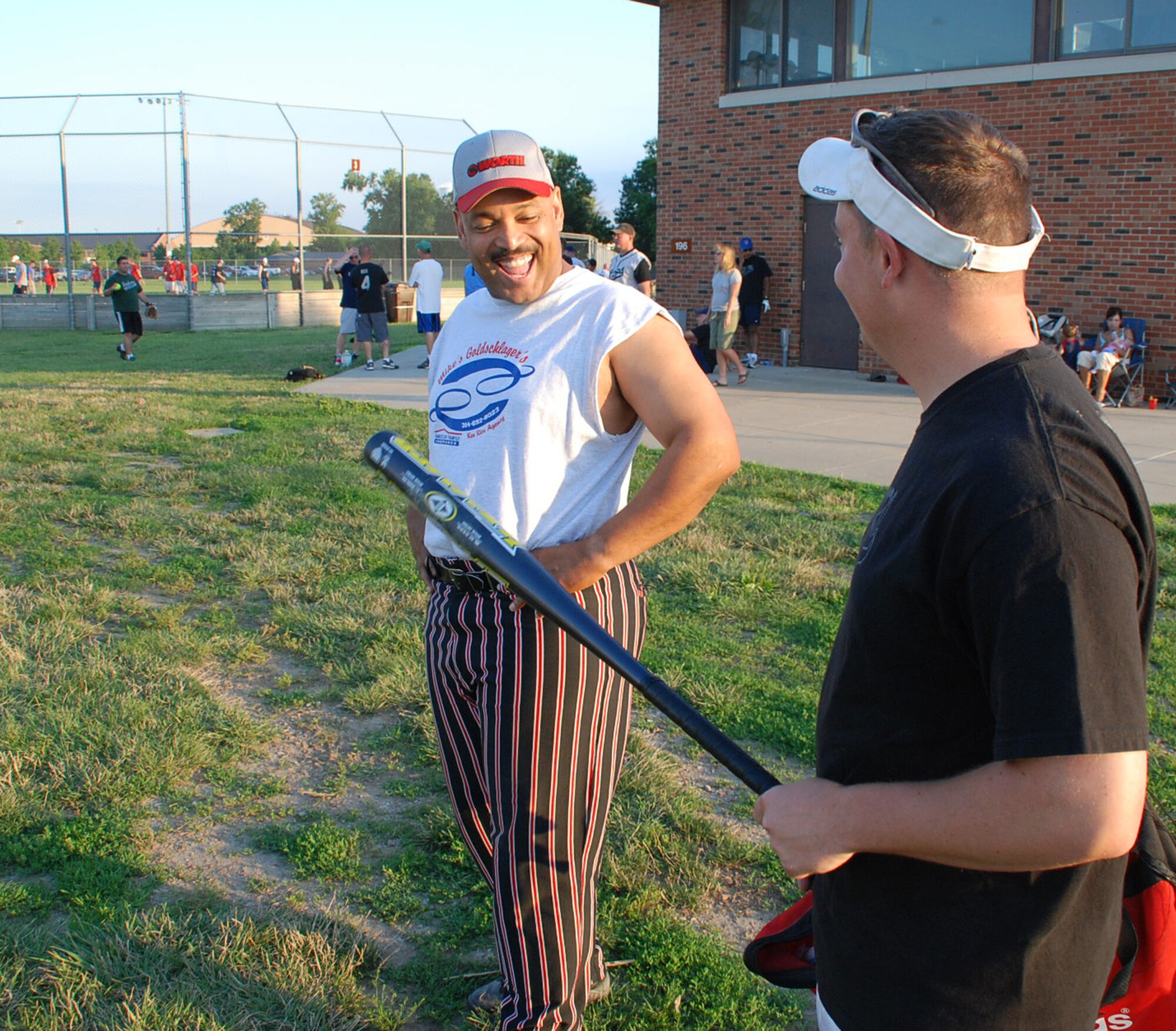 "DJ" Ellis talks about bat strategy at the 932nd Airlift Wing's latest softball game in July.  Bats were swinging but the wing lost to security forces.  Photo/Maj. Stan Paregien