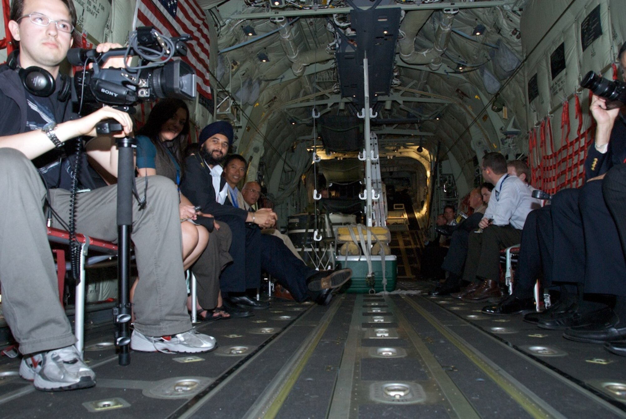 The media wait patiently in the cargo bay of the 403rd Wing's C-130J.

Media Day at the world's largest air show in Farnborough, England was a huge success for the Air Force Reserve Flying Jennies. Nearly 50 media flew along documenting the Reserve mission in the C-130J and the unique capabilities of the most technologically advanced C-130 ever.

The Farnborough Air Show will be open to the public Saturday and Sunday, July 19-20, 2008.