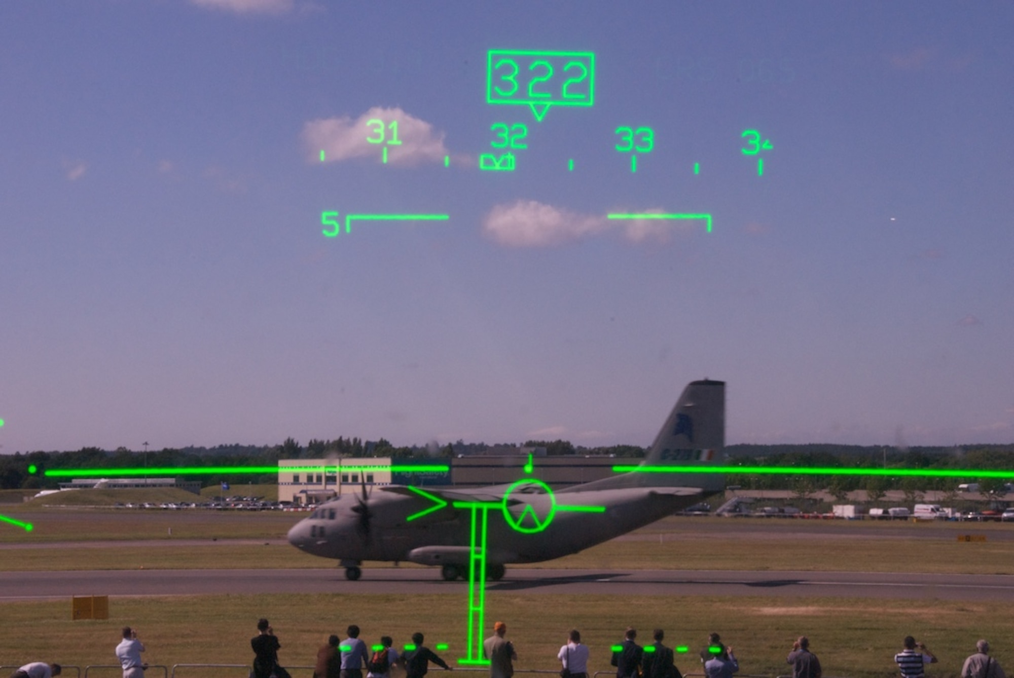 The view from the Heads-Up Display of the Reserve 815th Airlift Squadron 'Flying Jennies' C-130J aircaft while an Alenia C-27J Spartan takes off for a demonstration at the Farnborough Air Show.

The HUD is unique to the J-model and allows the pilot to see flight data constantly while looking out the windshield. The J-model is the only C-130 in the world with a HUD.