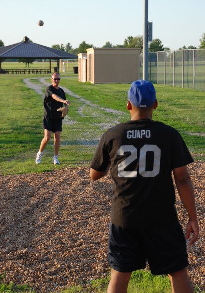932nd Airlift Wing pilots and maintenance experts traded planes and wrenches for balls and gloves as they prepared for a softball game in July.  They went up against the feared security forces team and lost, but one maintainer commented, "It's a good time for wing members and the weather was great."  Photo/Maj. Stan Paregien