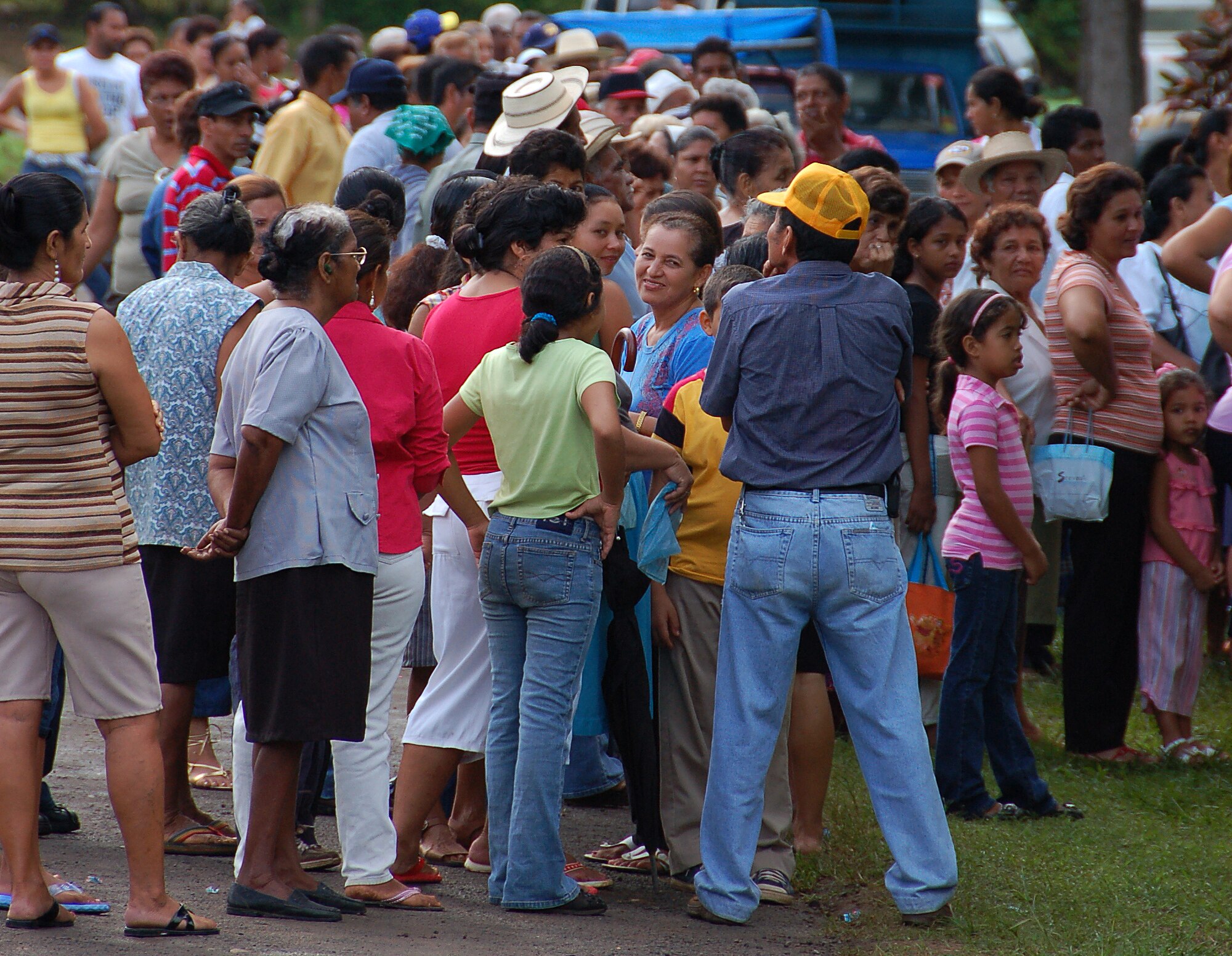 A crowd of local residents waits outside of the compound fence at the Escuela de Cabuya school in Cabuya, Panama on the third morning of the Medical Readiness Training Exercise (MEDRETE) Panama 16 July. The MEDRETE is a two-week long U.S. Southern Command-sponsored and AFSOUTH-coordinated exercise designed to hone the skills of medical personnel while providing free health care in remote locations through partnership with host nation doctors. Approximately 1700 patients were seen by the medical staff at the Cabuya location 14-16 July. (Photo by Capt. Ben Sakrisson, Air University Public Affairs)