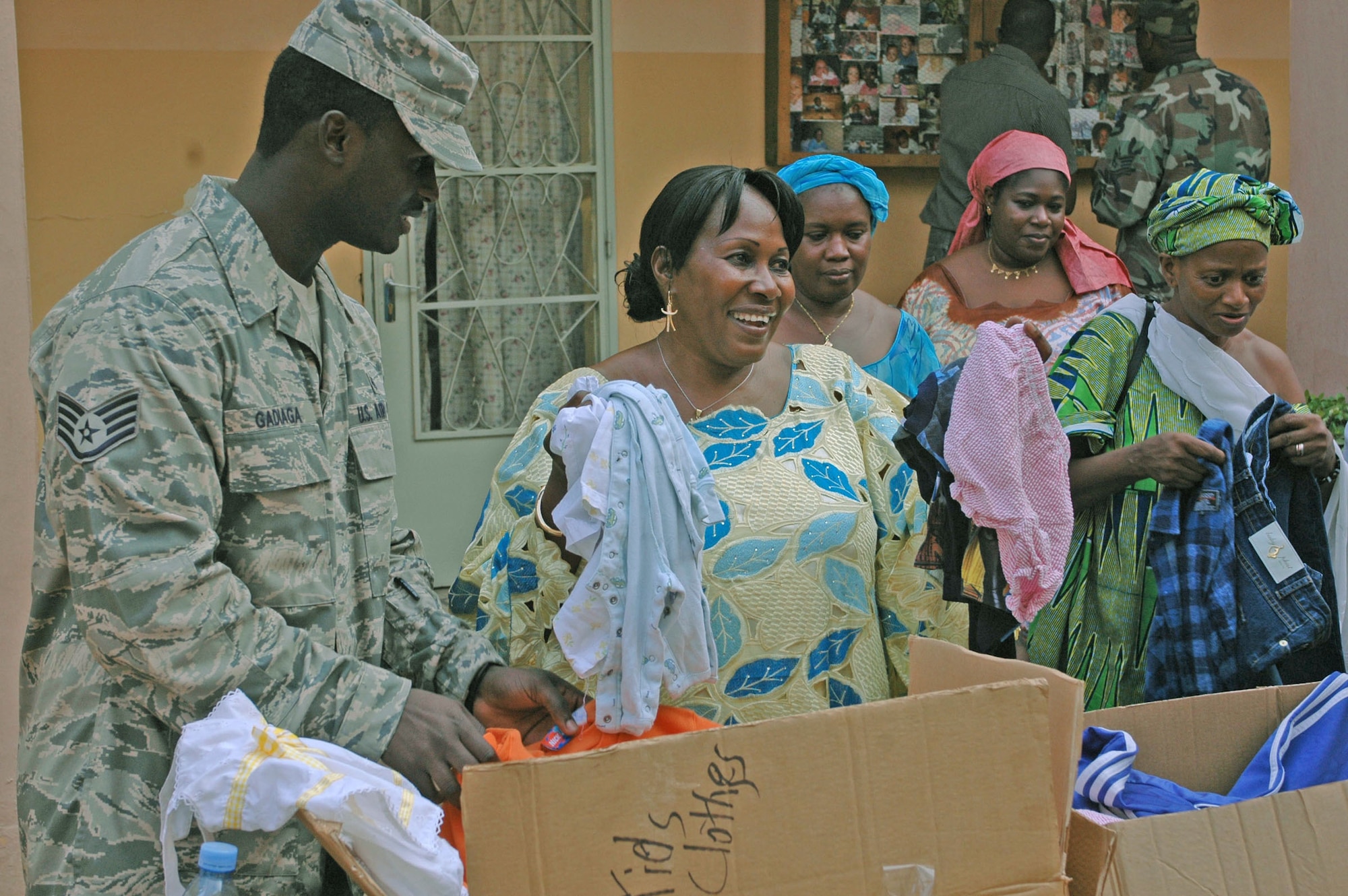 Staff Sgt. Mouhamed Gadiaga presents Nene Duattara, Bamako National Orphanage director, with boxes of donated clothes collected from Airmen and their families at Aviano Air Base, Italy. Sergeant Gadiaga is one of more than 90 servicemembers deployed to Bamako for MEDFLAG 08, a multi-national medical training exercise designed to enhance medical capabilities and readiness for U.S. and African forces. Sergeant Gadiaga is assigned to the 31st Medical Group, Aviano Air Base, Italy. (U.S. Air Force photo/Senior Airman Justin Weaver)