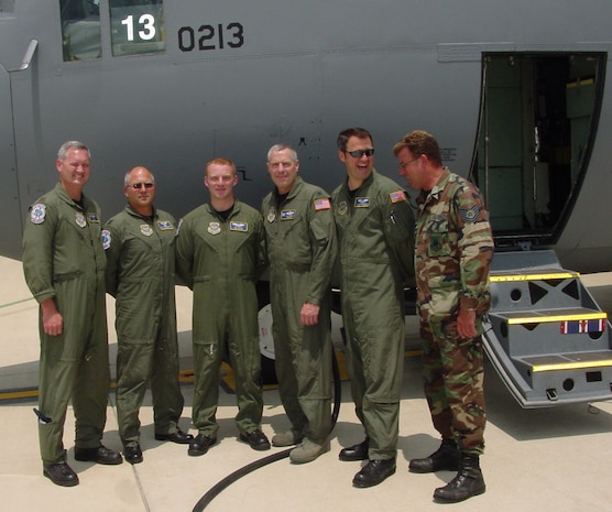 Aircrew and crew chief for Delaware Air National Guard C-130H tail # 213 stand together after 10,000 flying hour mark was broken June 5, 2008. This became the first unit aircraft to reach the milestone since the aircraft arrived new in the mid-1980s. L to R: Aircraft commander and pilot Maj. Tim Casey, Navigator Capt. Mark Linzmeier, loadmaster Senior Airman Philip Harris, pilot Col. Jonathan Groff and commander, 166th Airlift Wing, flight engineer Tech. Sgt. John DeFrancesco and crew chief Tech. Sgt. Scott Nybakken. 