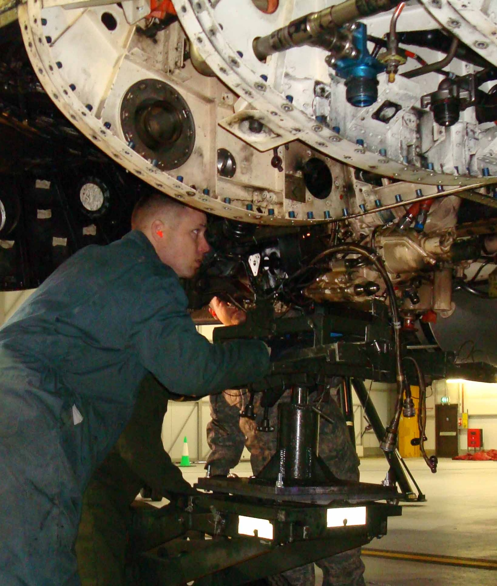 Squadron members remove a B-1 bomber's engine while on a temporary duty asignment.  (Courtesy photo)
