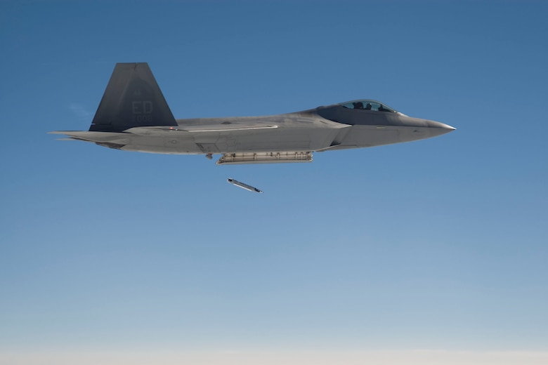 An Edwards F-22 Raptor drops a GBU-39 Small Diameter Bomb for the first time July 11 as part of a safe separation test to integrate the bomb to the aircraft. The SDB is a 250-pound class precision guided munition capable of destroying high-priority stationary targets from Air Force fighters and bombers from stand-off distances. 
(Lockheed-Martin photo by Kevin Robertson)
