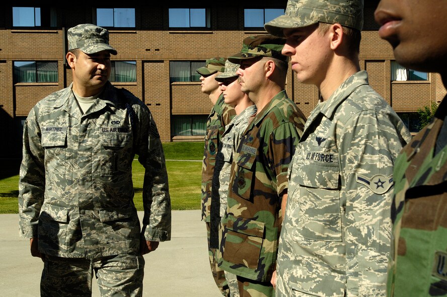 FAIRCHILD AIR FORCE BASE, Wash. – Tech. Sgt. Gregorio Martinez, 66th Air Training Squadron chief military training leader, performs an open ranks-inspection on students in the 66th TRS. He receives high praises from the 66th TRS for all his hard work. (U.S. Air Force photo / Senior Airman Eunique Stevens)
