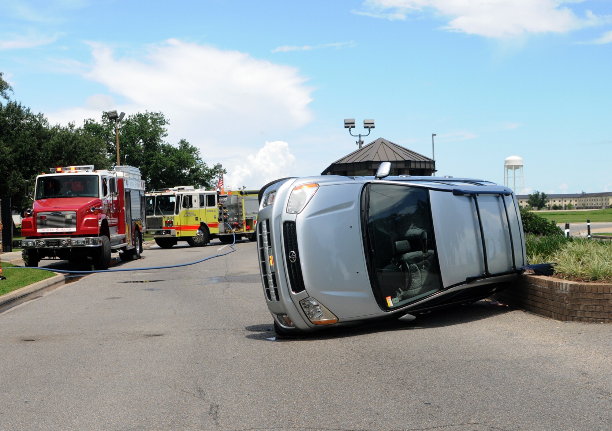 A motorist leaving Keesler by way of the Pass Road Gate hit a bollard and flipped this vehicle July 9.  Investigators with the 81st Security Forces Squadron urge motorists to be cautious, attentive and maintain the posted speed when entering or leaving the gate areas.  (U.S. Air Force photo by Kemberly Groue)