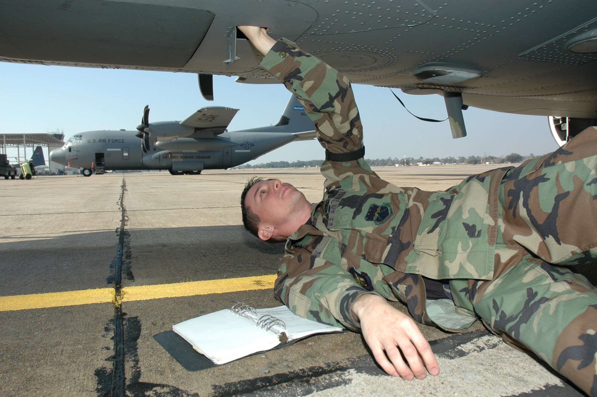Senior Airman Michael Gehl, communications/navigation technician with the 403rd Wing’s avionics flight, checks the Doppler velocity sensor on a C-130J during a maintenance inspection.   This type of inspection is conducted after an aircraft leaves the washrack.  Other checks after a wash include a corrosion inspection and a function check of the antenna selectors inside the aircraft.  (U.S. Air Force photo by Tech. Sgt. Michael Duhe)