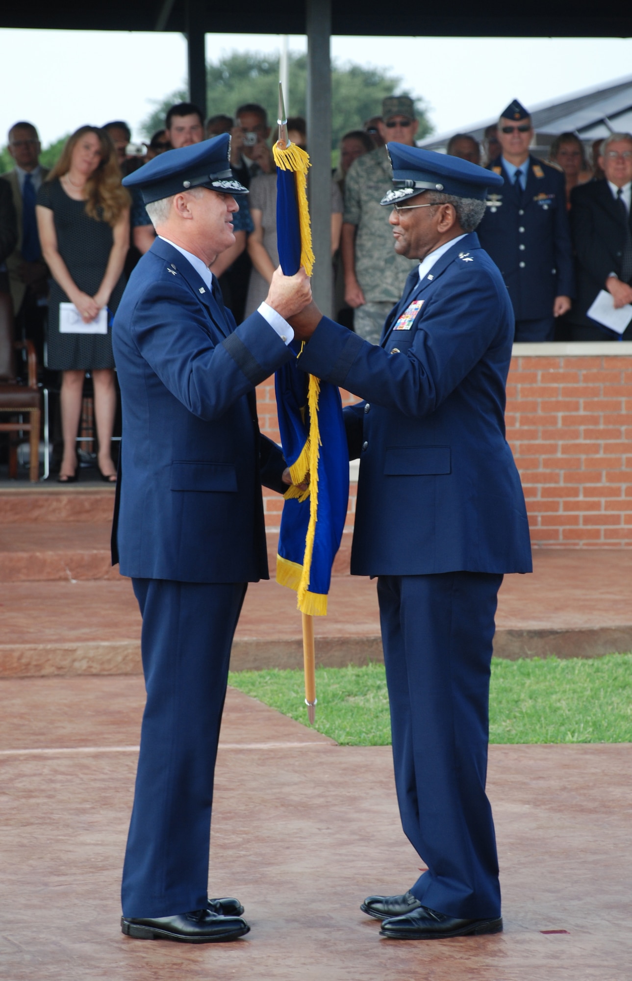 Maj. Gen. Alfred Flowers, 2nd Air Force commander, gives command of the 82nd Training Wing to Brig. Gen. O.G. Mannon July 17 in a change-of-command ceremony at the Sheppard parade grounds. (U.S. Air Force photo/Airman 1st Class Jacob Corbin)