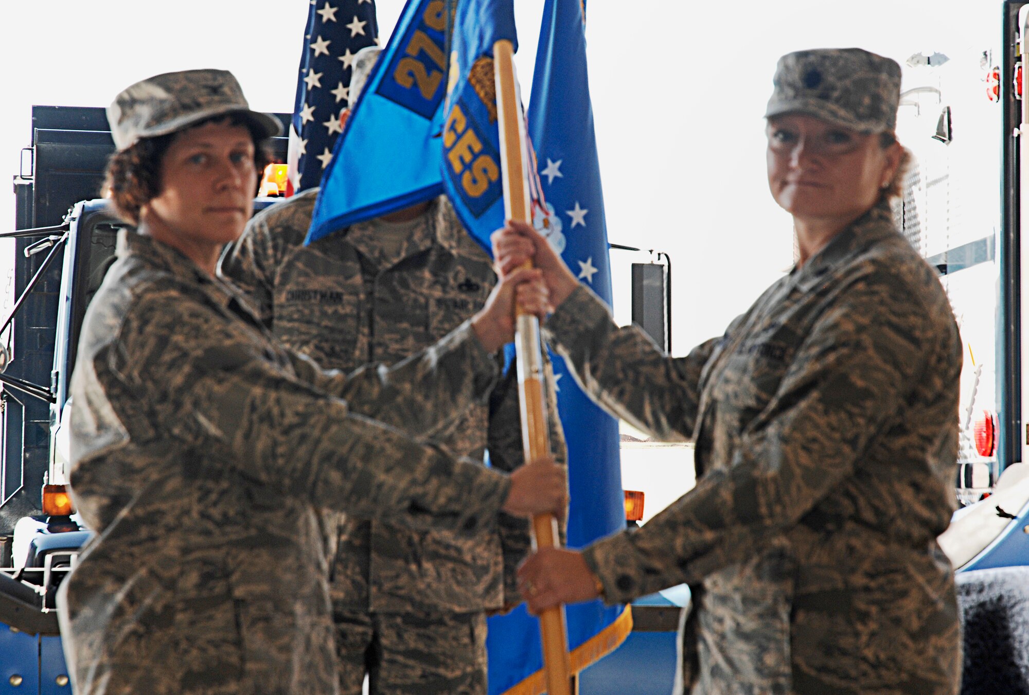 CANNON AIR FORCE BASE, N.M. -- Lt. Col. Anne Coverston receives the guidon and command of the 27th Special Operations Civil Engineer Squadron from Col. Babette Lenfant, 27th Special Operations Mission Support Group commander.  Colonel Coverston assumed command from Lt. Col. Stephen Wood in a change-of-command ceremony July 17. (U.S. Air Force photo/Senior Airman Liliana Moreno)
