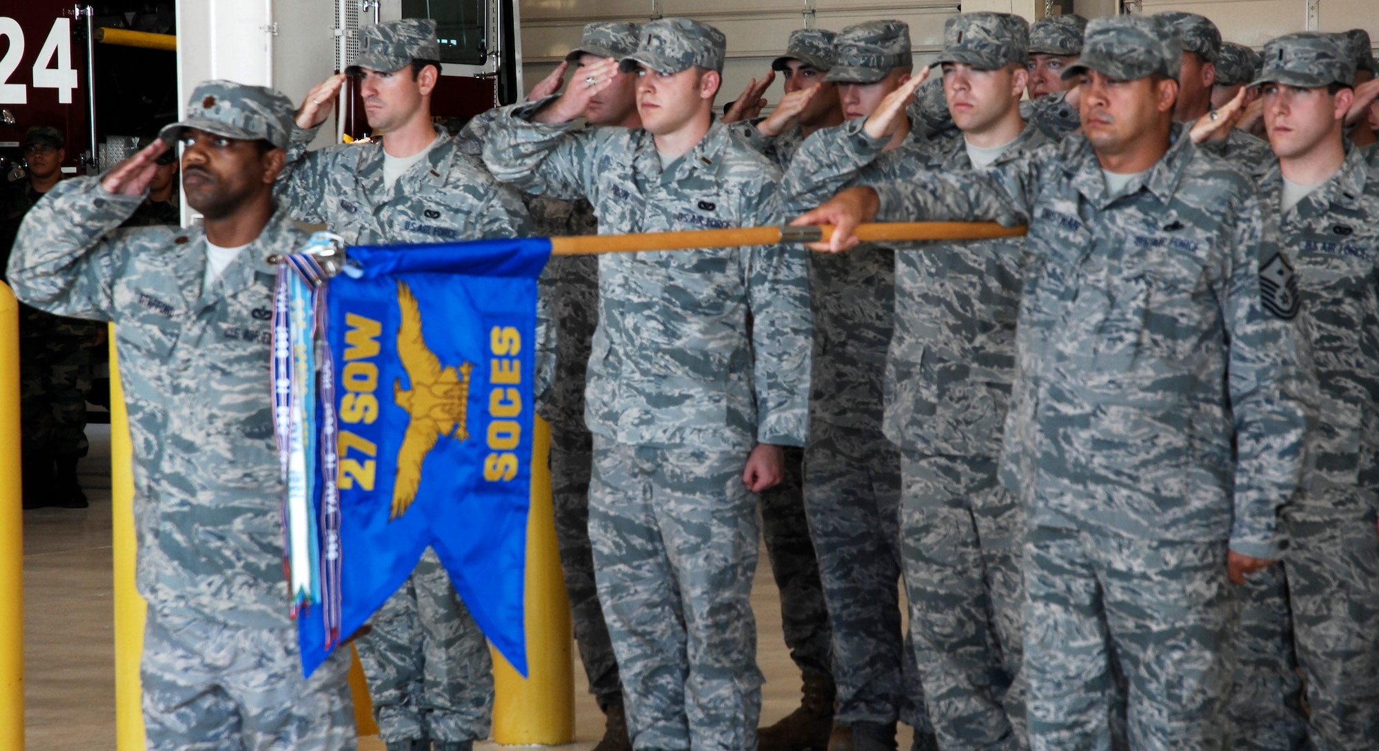 CANNON AIR FORCE BASE, N.M. -- The 27th Special Operations Civil Engineer Squadron renders a  salute during the 27th SOCES change-of-command ceremony July 17. Lt. Col. Anne Coverston assumed command from Lt. Col. Stephen Wood. (U.S. Air Force photo/Senior Airman Liliana Moreno)