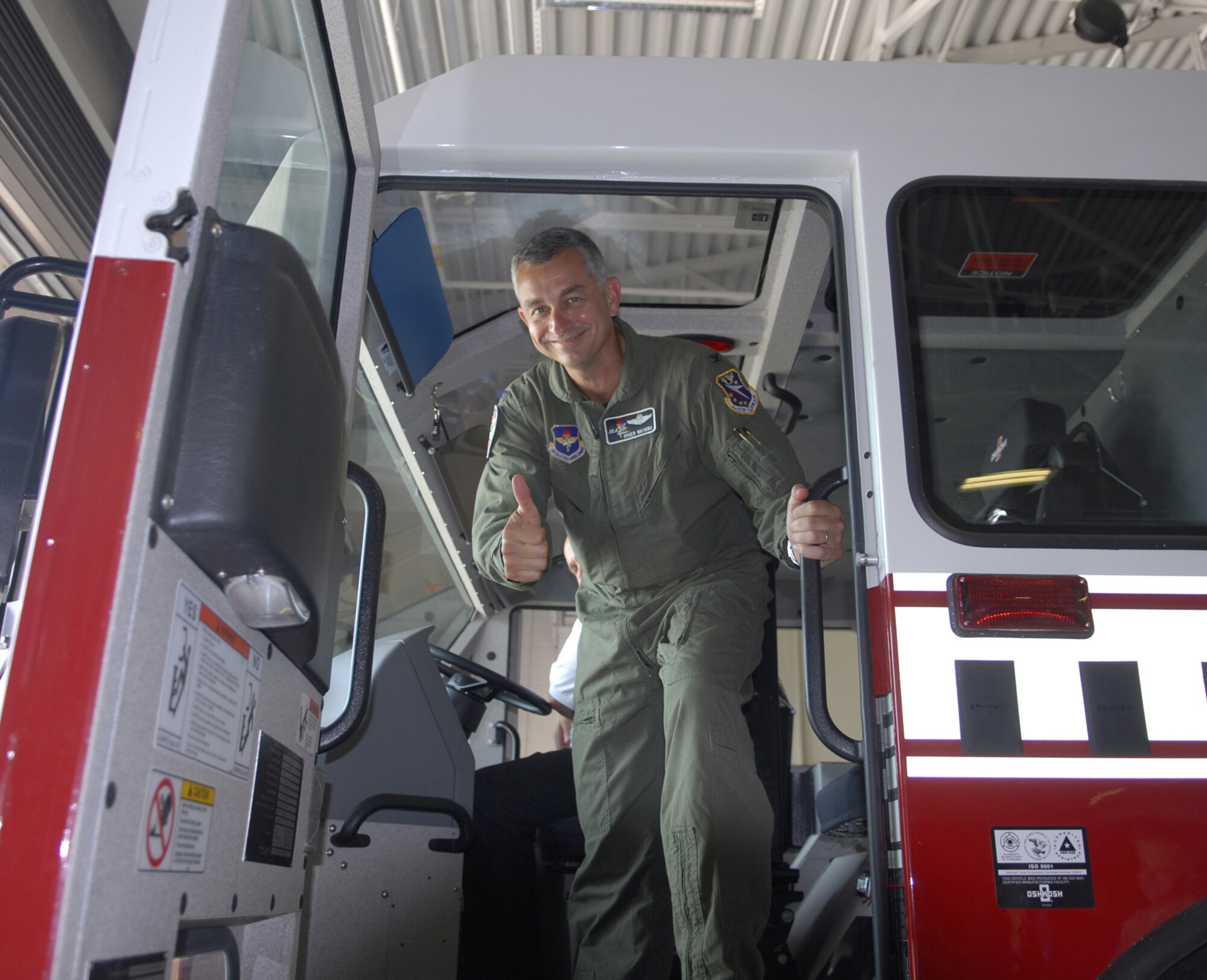 Colonel Roger Watkins, 14th Flying Training Wing commander, tours a fire truck during his immersion of the 14th Mission Support Group at the Columbus AFB fire department. Colonel Watkins was able to have lunch with the firefighters of the 14th Civil Engineer Squadron July 10. (U.S. Air Force photo by Elizabeth Owens)