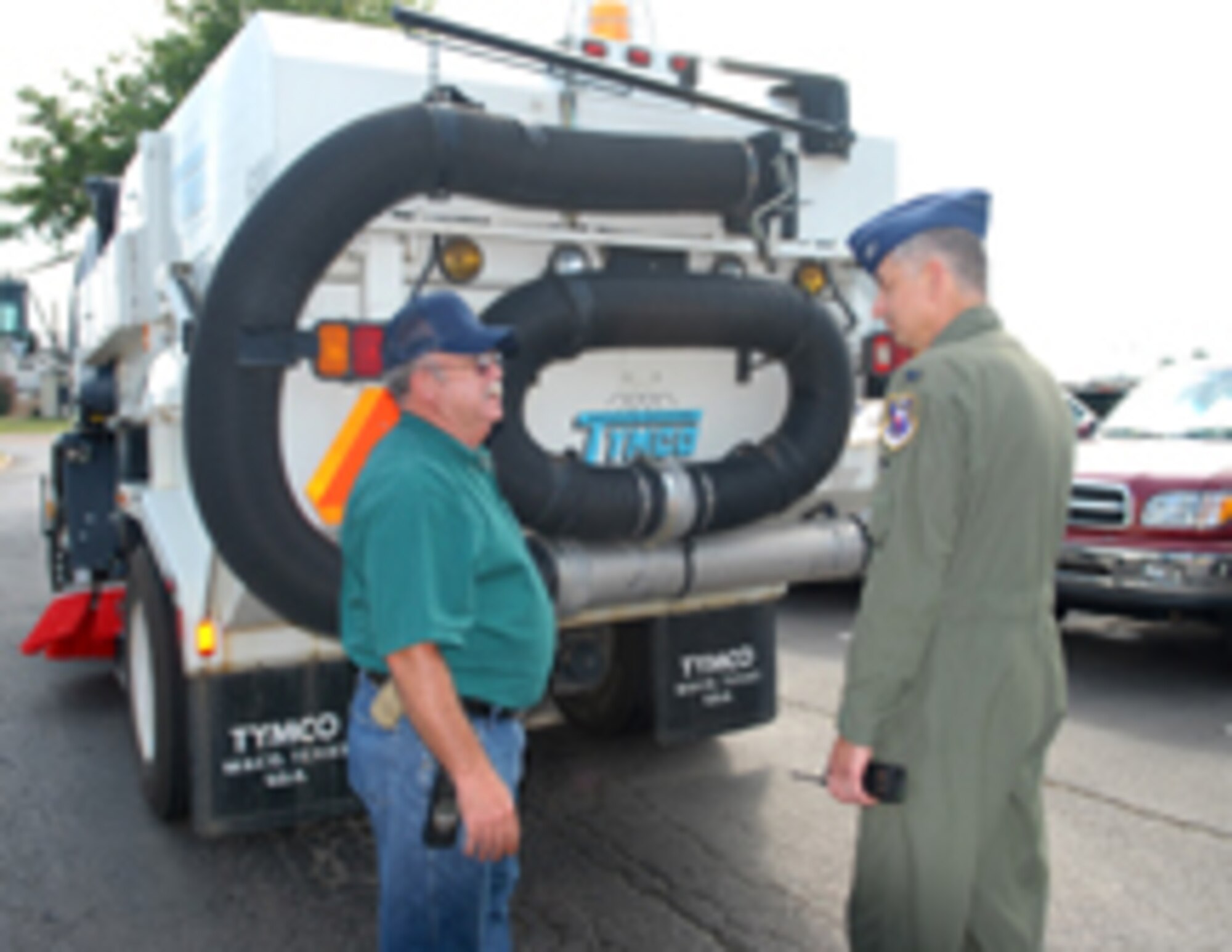 Delbert Lowe, 14th Civil Engineer Squadron, speaks with Col. Roger Watkins, 14th Flying Training Wing commander during Colonel Watkins’ immersion of the 14th Mission Support Group. Mr. Lowe drives the street sweeper on Columbus AFB. (U.S. Air Force photo by Elizabeth Owens)