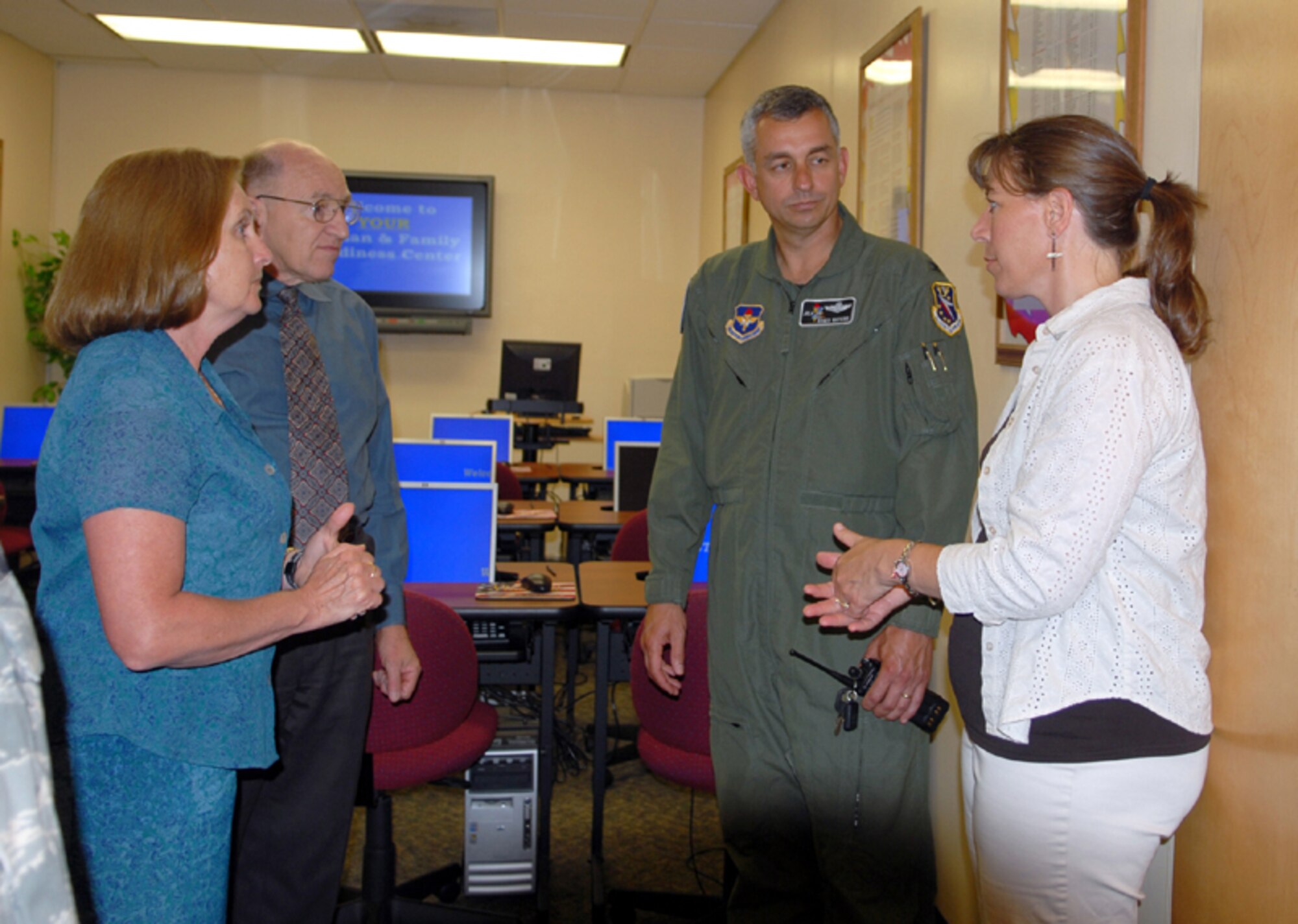 Colonel Roger Watkins, 14th Flying Training Wing, speaks with Mark Horning and Patsy Wood from the Airman and Family Readiness Center during his immersion or the 14th Mission Support Group.  (U.S. Air Force photo by Elizabeth Owens)