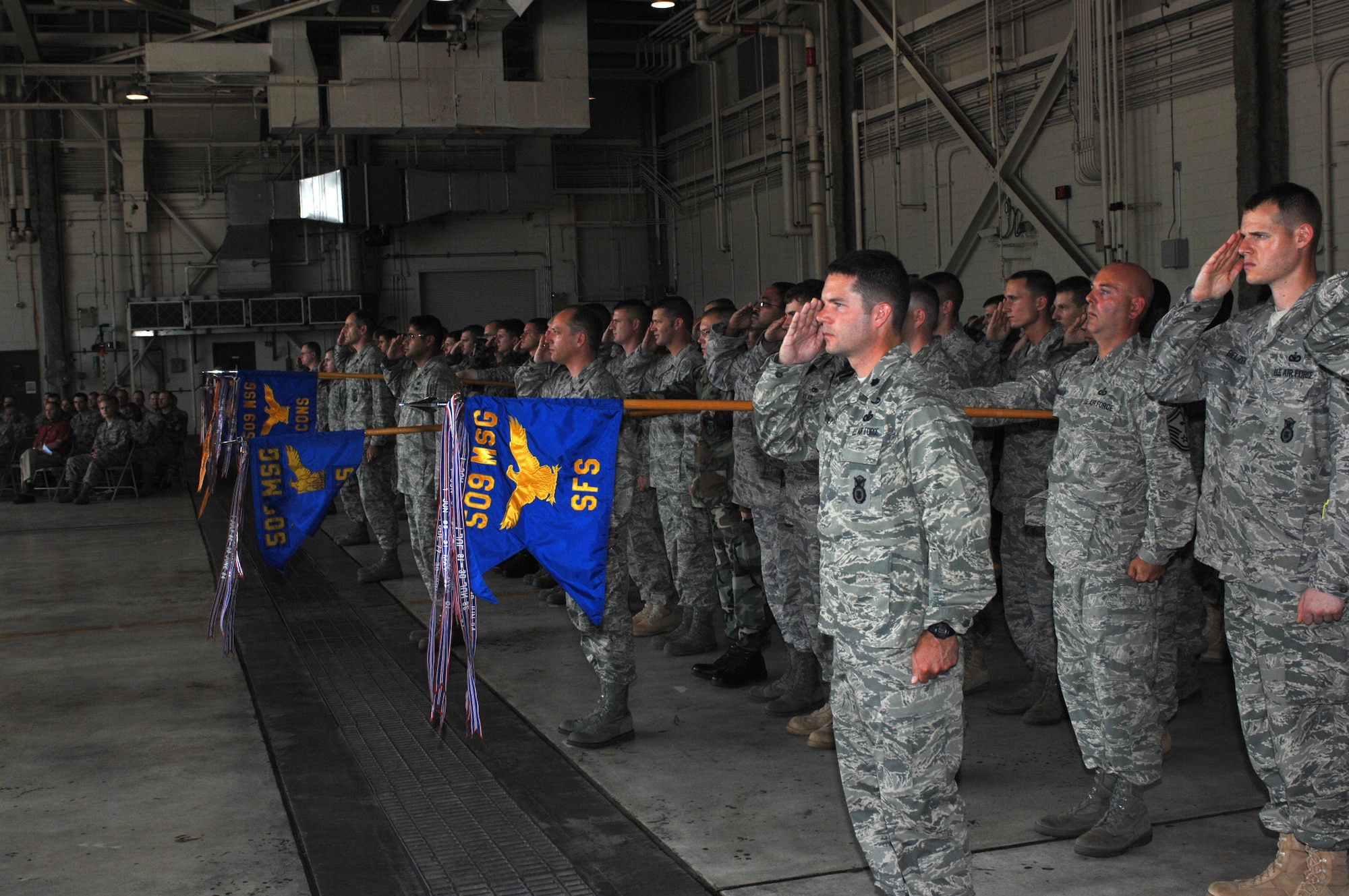 WHITEMAN AIR FORCE BASE, Mo.,- Team Whiteman members salute Col. Patricia I. McGinnis who assumed command of the 509th Mission Support Group from Col. Edward Keegan during a change of command ceremony July 11. (U.S. Air Force photo/Staff Sgt. Charles Larkin Jr.)