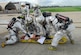 SOTO CANO AIR BASE, Honduras ? Joint Task Force-Bravo fire fighters work to stabilize a simulated victim of a C-21 crash July 10. The fire fighters were charged with the task to put out a simulated fire and rescue the trapped occupants of the simulated plane. The fire fighters were part of a base-wide exercise that simulated a mass casualty, anti-terrorism and force protection scenarios. (U.S. Air Force photo by Staff Sgt. Joel Mease)