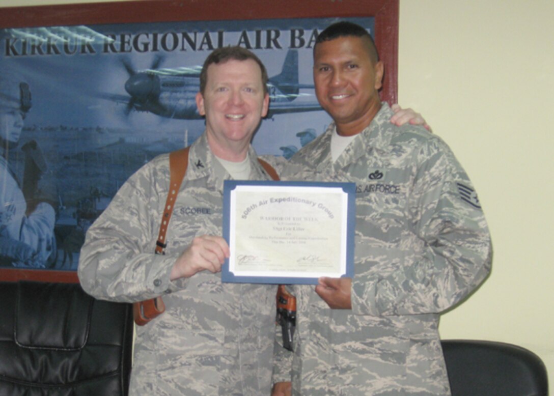 507th Air Refueling Wing Civil Engineer Squadron member Staff Sgt. Erick Liftee has received a WOW certificate for his superior work while deployed to Kirkuk AB, Iraq.
  Sergeant Liftee is an Air Force Reserve structural engineer currently deployed in support of Operation Iraqi Freedom.
 In addition to receiving a certificate of appreciation Sergeant Liftee was presented with a commanders coin from (pictured) Col. Richard Scobee, 506th AEG commander.  Colonel Scobee is also an Air Force Reservist and stateside is the commander of the 944th Fighter Wing out of Luke AFB, Ariz.
