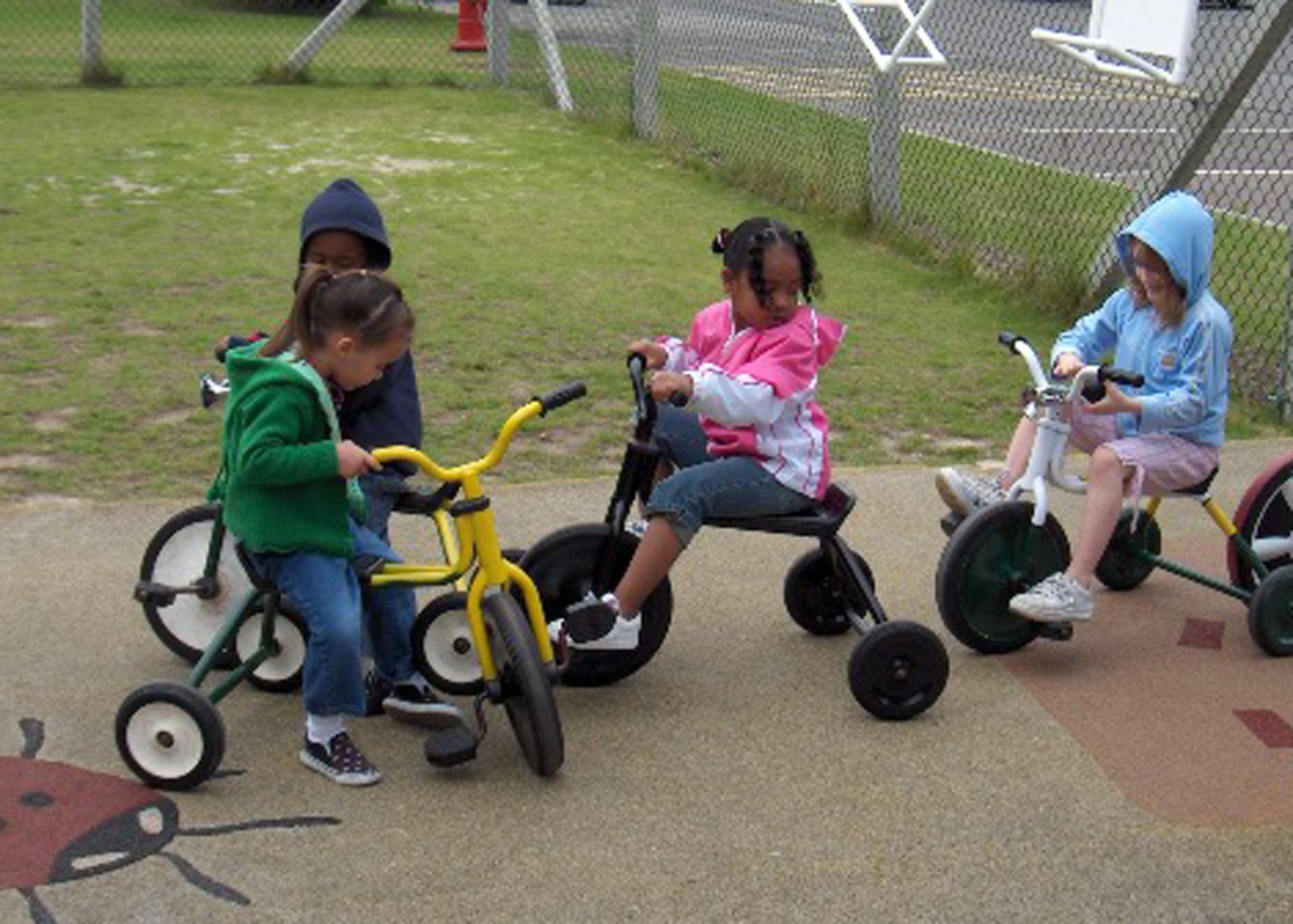 Children from the Mildenhall Child Development Center on RAF Mildenhall play with the CDC's recently refurbished tricycles. The 48th Equipment Maintenance Squadron Aeorspace Ground Equipment flight volunteered to refurbish the tricycles, saving the CDC more than $3,500. (U.S. Air Force photo)