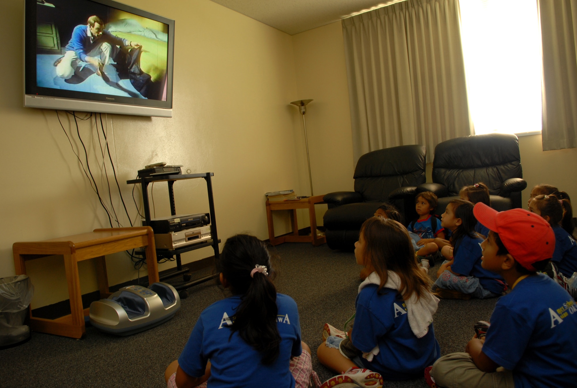 Students from the AmerAsian school watch a video at the Kadena Fire Station. Approximately 70 students toured the fire station Monday and learned how to prepare a fire escape plan. (U.S. Air Force photo/Junko Kinjo)