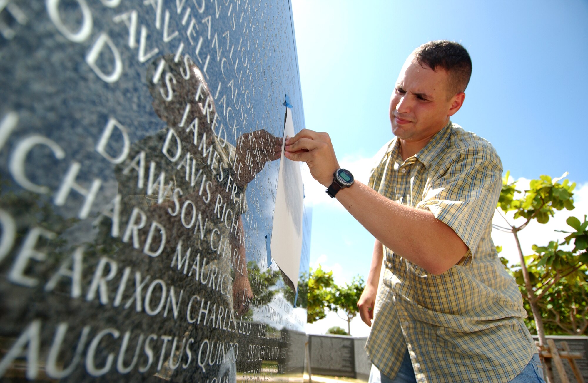 Sergeant Follis prepares another rubbing for one of his requesters. He receives requests for photos and name rubbings via his Web site www. Okinawamemorialrubbings.org.  (U.S. Air Force photo/Tech. Sgt. Rey Ramon) 