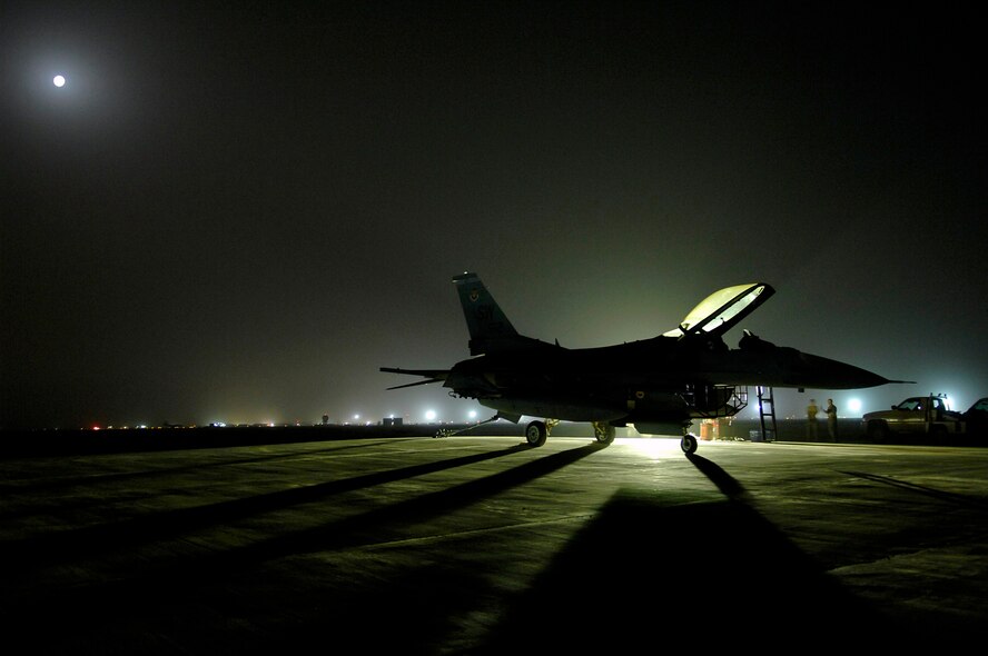 JOINT BASE BALAD, Iraq -- An F-16 Fighting Falcon sits on a trim pad before an engine run up here July 16. The run up of the engine back and forth from full afterburner to idle allows the engine mechanics and crew chiefs to ensure all systems are fully functional before putting the fighter back into operational use. The F-16 is deployed from Shaw Air Force Base, S.C. (U.S. Air Force photo/Senior Airman Julianne Showalter)