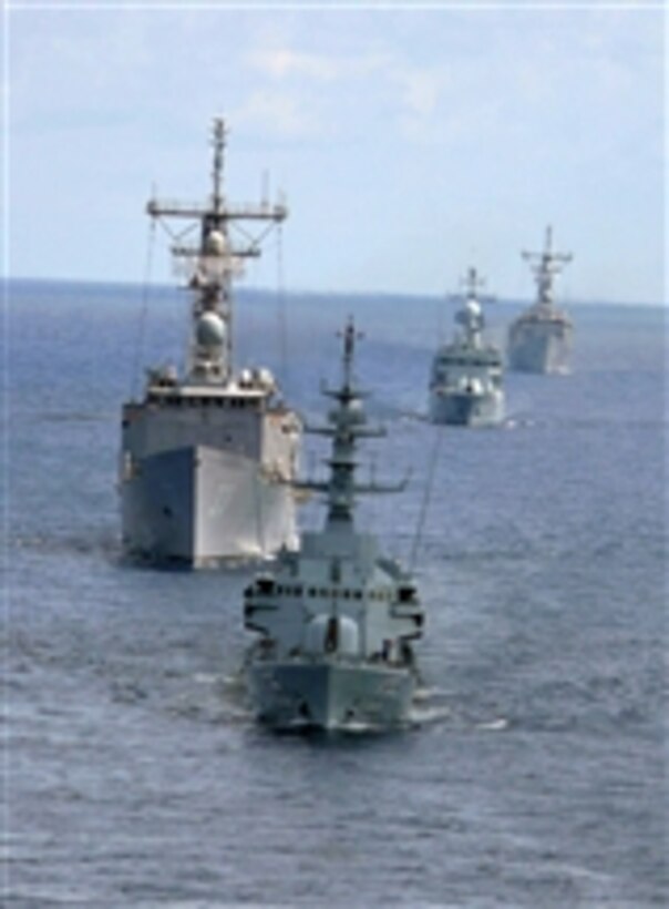 U.S. and Malaysian ships maneuver during a drone exercise as part of Cooperation Afloat Readiness and Training 2008.  This exercise is an annual series of bilateral maritime training exercises between the United States and six Southeast Asia nations designed to build relationships and enhance the operational readiness of participating forces.  