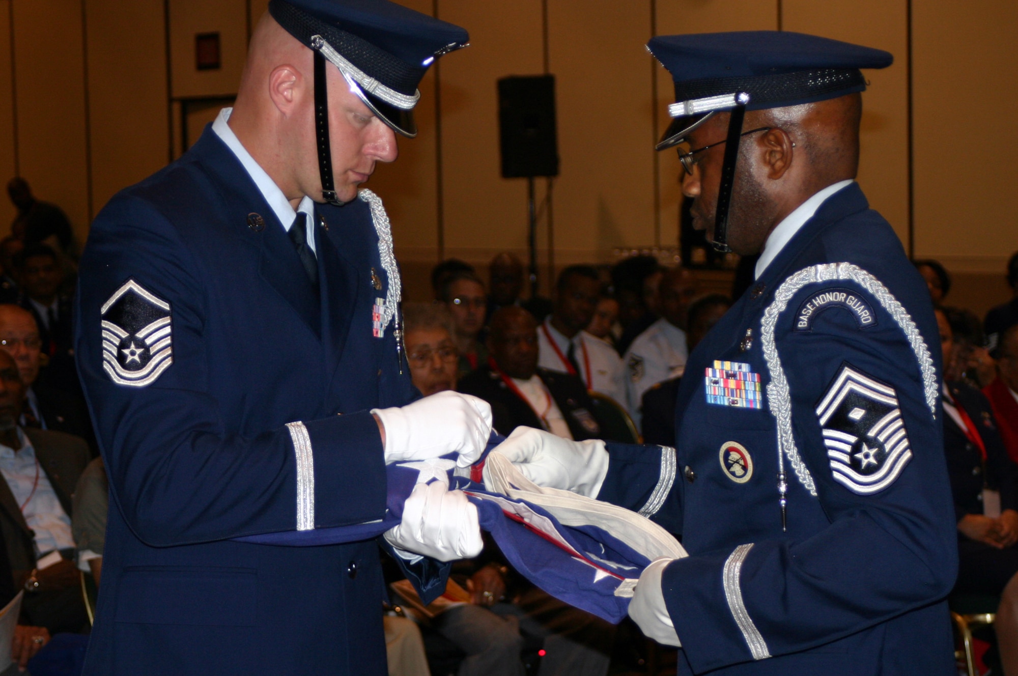 Airmen from the 514th Air Mobility Wing elite honor perform a flag-fold ceremony for fallen Airmen during a Lonely Eagles Memorial Service ceremony July 18 in Philadelphia. The ceremony was part of the 37th Tuskegee Airmen Convention continuing through July 20. (U.S. Air Force photo/Airman 1st Class Bekah Phy)