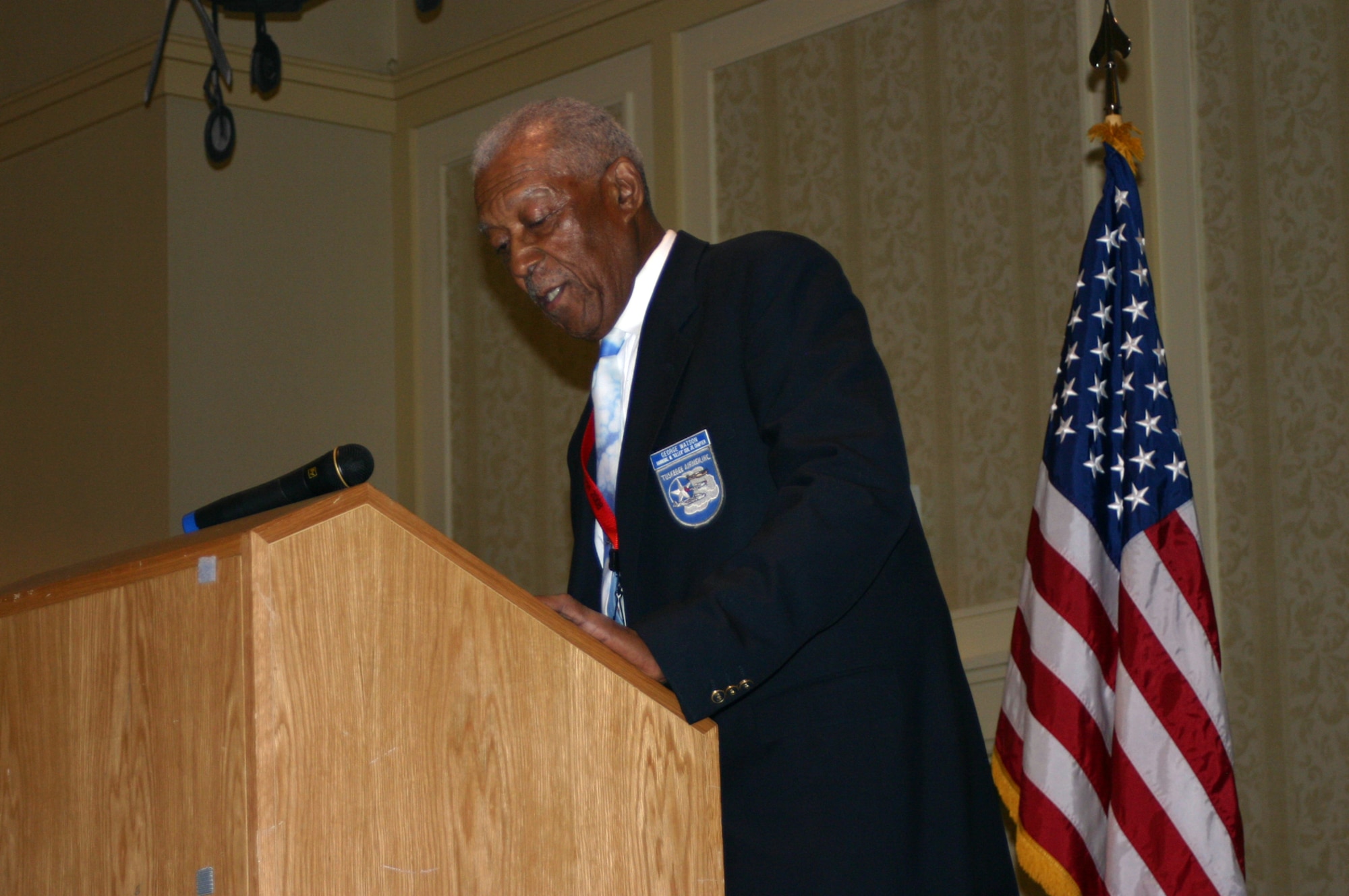 George Watson, Sr., original Tuskegee Airman, reads the names of recently fallen Tuskegee Airmen who were recognized during a Lonely Eagles Memorial Service ceremony July 18 in Philadelphia. The ringing of a bell followed each name, and those in the audience who knew the deceased Airman stood in their honor. The ceremony was part of the 37th Tuskegee Airmen Convention continuing through July 20.  (U.S. Air Force photo/Airman 1st Class Bekah Phy)