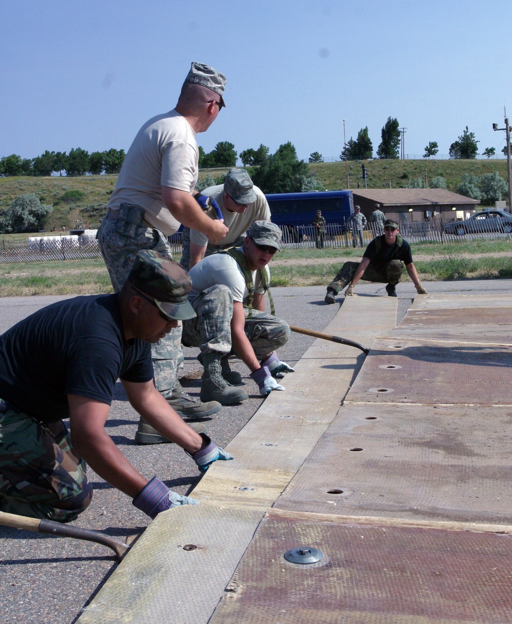 Members of the 419th Civil Engineer Squadron assemble a mat used for repairing a damaged runway during a training exercise during the July Unit Training Assembly. The exercise gave CE members a chance to practice crucial skills and receive important training. 