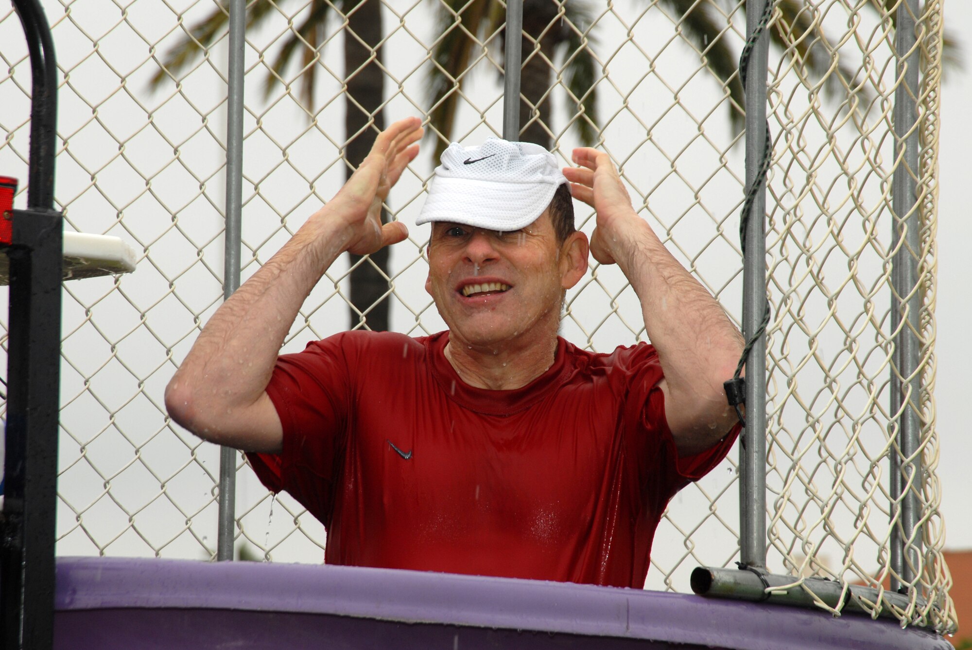 Douglas Loverro, SMC Executive Director, takes a dip in the dunk tank during SMC’s Sports Day, July 10. (Photo by Joe Juarez) 