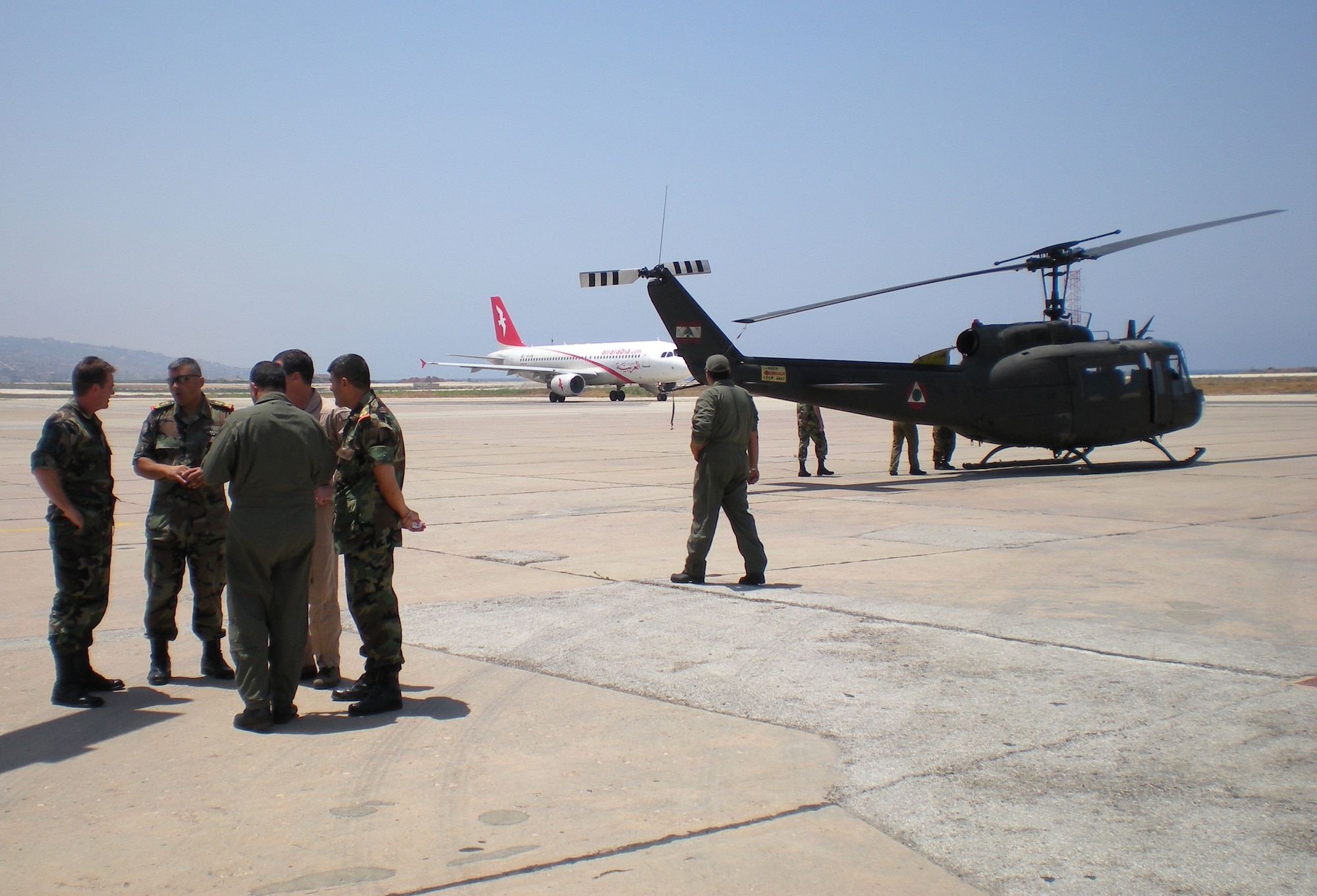 Members of a team from U.S. Air Forces Central tour the flight line and an LAF UH-1 helicopter during a recent visit to Beirut to encourage cooperation between the services June 25.  The team received briefings and a tour of Beirut Airport June 25. (U.S. Air Force photo by Capt. Randy Allen)