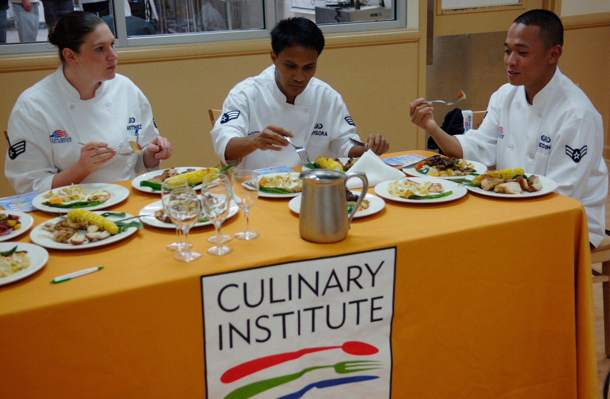 LANGLEY AIR FORCE BASE, Va. -- Senior Airman Ashley Martinez, Senior Airman Kelmer Rapisora, and Airman 1st Class Ghil Medina ,1st Force Support Squadron food service journeymen, acted as judges for an inter-service cook-off at the Culinary Institute of Virginia in Norfolk July 17. The cook-off was between two navy teams from the Norfolk Naval Air Station. (U.S. Air Force photo/Tech. Sgt. Levi Collins)