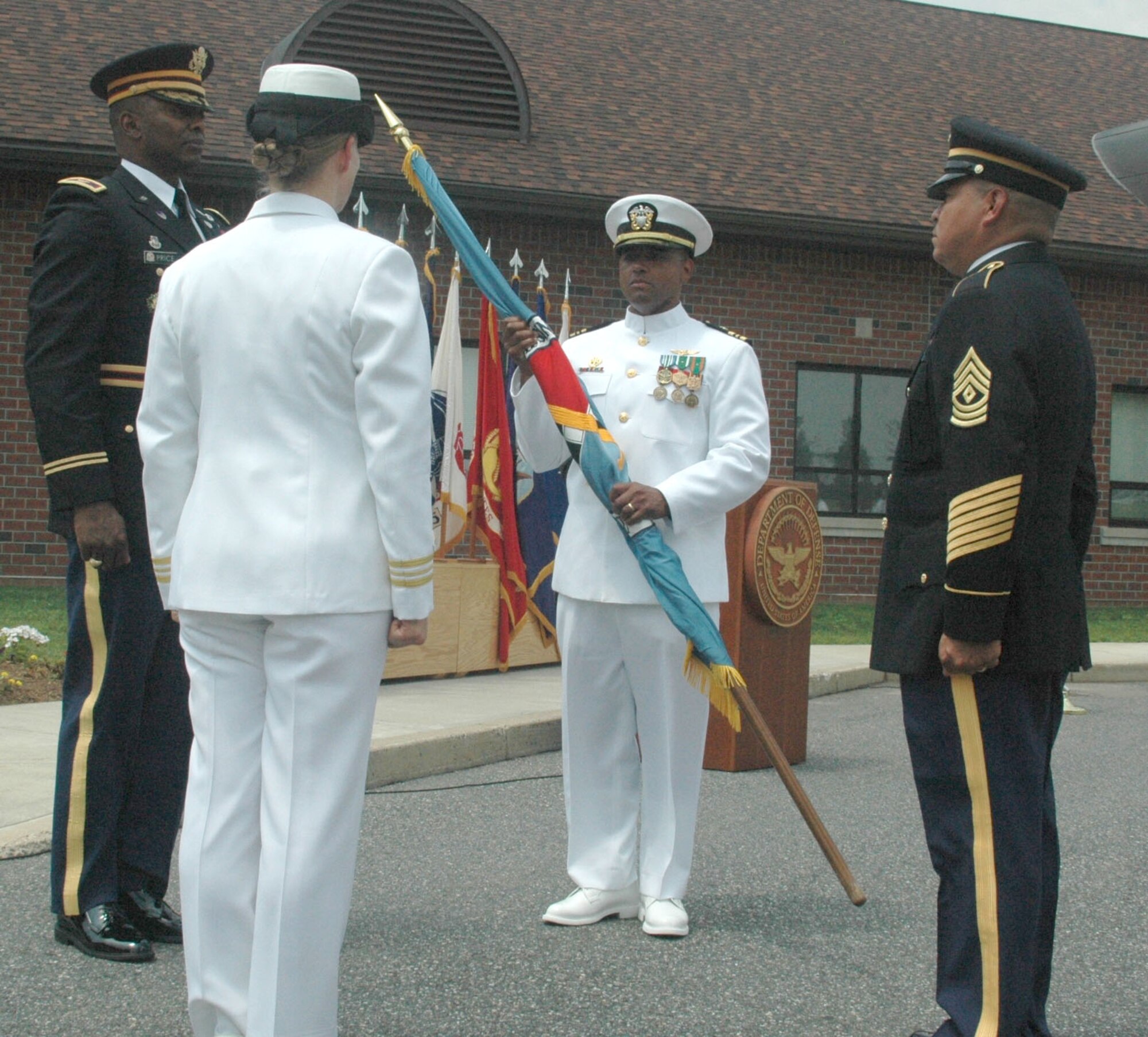 Lt. Cdr. XXXX takes command of the Springfield Military Entrance Processing Station from Lt. Cdr. Renee Squier July 8 at Westover Air Reserve Base, Mass. The MEPS is one of many tenant units at Westover, physically the largest Air Force Reserve installation in the country.